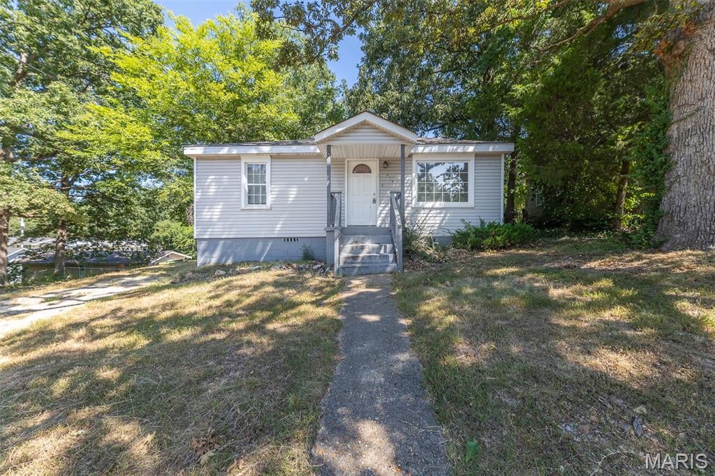 Take a look at this charming raised ranch in the heart of Poplar Bluff! This inviting home sits on a desirable corner lot in a convenient location close to shopping, hospitals, restaurants, and everyday amenities. Outside, you'll find a chain-link fenced backyard with a patio, offering a great space for relaxing or letting kids and pets play. The roof was replaced approximately two years ago, providing an added peace of mind. Previously utilized as a rental property generating $950 per month, this home presents an great opportunity for an investor looking for an income-producing property or a buyer searching for an affordable home with potential. With just a little TLC, this property could easily continue as a rental or become a comfortable place to call home. Don't miss this opportunity to add a conveniently located property to your portfolio or make it your own!