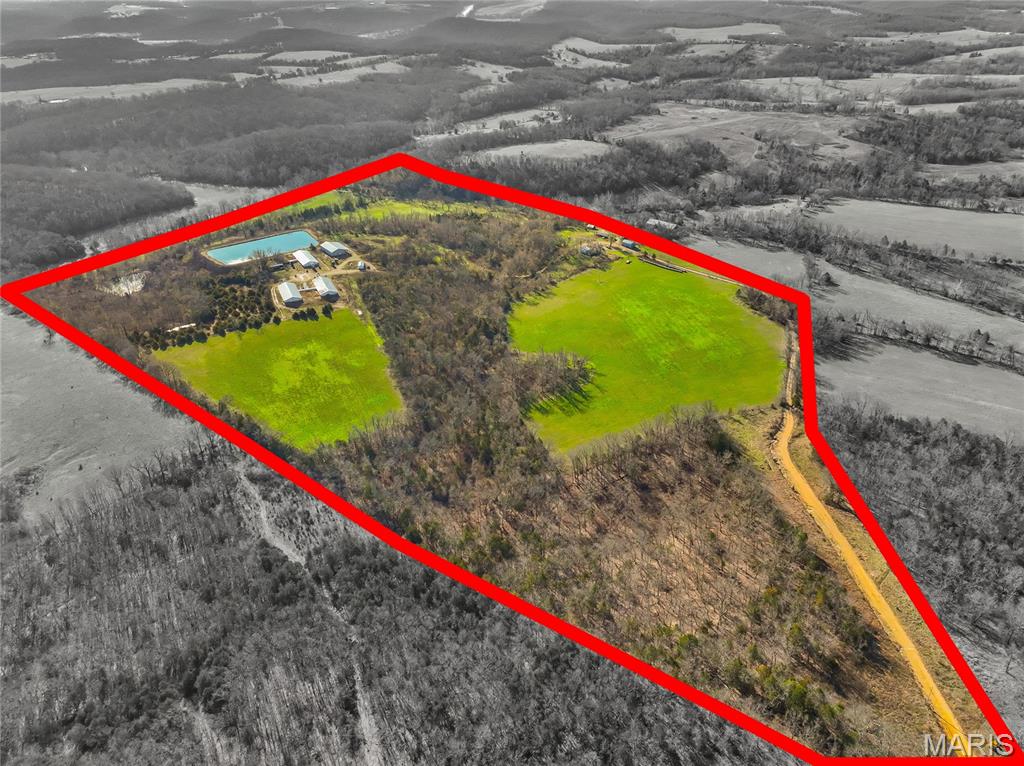 Don’t miss this **rare opportunity to own nearly 80 acres just outside of Vienna in the highly sought-after Vienna R-I School District. This versatile property offers the perfect mix of agricultural potential, recreation, and investment value.
  The land features excellent wildlife sign and scenic views, making it an outstanding property for hunting and outdoor recreation near the productive Gasconade River bottoms.
  It was recently operating as a turnkey hog operation, the farm includes three hog barns ready for production, with the flexibility to be converted for poultry or other livestock operations. The barns are connected to an approximately 3-acre lagoon system, which is already plumbed for irrigating the farm’s fields, providing valuable infrastructure for continued agricultural use.
  In addition to the hog facilities, the property also includes three additional outbuildings, a small office building, and a 2-bedroom farmhouse ready for renovation—offering the potential to create a comfortable homestead, farm headquarters, or rental opportunity.
  With a little cleanup and some cross-fencing, this property could easily become a productive cattle farm, hobby farm, or premier recreational retreat.
  Properties with this combination of acreage, infrastructure, and location don’t come along often.