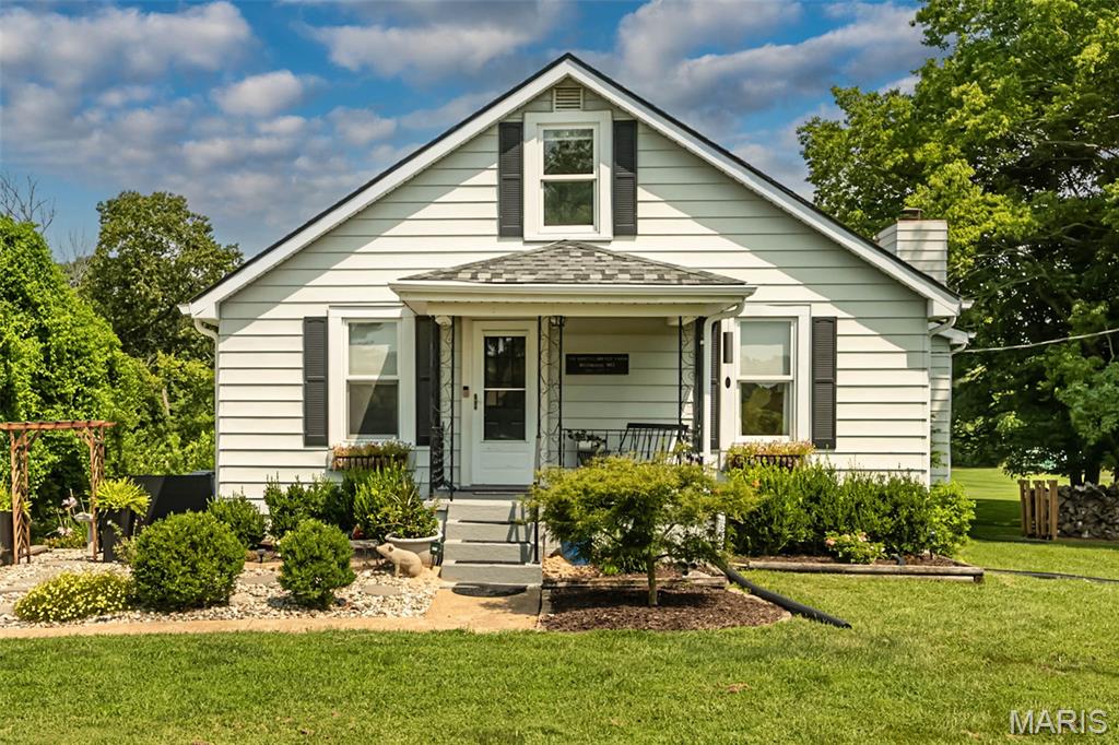 This charming home is situated on a 1-acre private park-like setting and is conveniently located close to highway access and to the Wildwood town center, dining and shopping. If you are looking for a close to all the amenities home, but not in a crowded subdivision, this is your home. What appears to be a small bungalow of a home is a BIG fooler. The kitchen, breakfast room, primary bedroom and family room are very large. There is plenty of room to add a huge kitchen island if you so desired. There are updates galore including a new roof and HVAC system in 2025. The bathrooms are updated and charming with tiled floors, newer mirrors, lights and plumbing fixtures. The home has been thoughtfully maintained and decorated with an extensive list of improvements including some newer light fixtures, some rocker switches, under cabinet lighting in the kitchen, wallpaper, wood beams, some battery-operated window shades, built in storage compartments in the living room and decorated wood walls in the hallway leading to the primary bedroom. One can't say enough about the amazing backyard with its firepit gathering area and its peaceful ambiance. There are two separate garages and a large hobby/storage area behind the second garage. This home is perfect for a family or as an investment property.