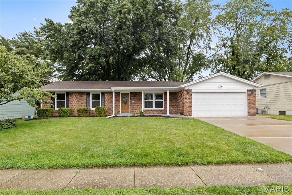 Renovation just completed on this updated 3 bedroom 2 full bathroom home in the heart of St. Charles! Brick front and covered porch will greet you as you enter! Lots of sunlight beaming through the NEW windows just installed throughout the home! All new LVP flooring flowing throughout almost the entire main level including all bedrooms! Spacious Great room leads to formal dining room. Kitchen boasts premium cabinets, stainless appliances, granite countertops, tile backsplash, and brand new flooring. Second living room with fireplace with easy access to the large patio overlooking large fenced in back yard! Primary bedroom suite with new vanity, tile flooring, cultured marble surround shower, all new shower door, and new fixtures. Two additional bedrooms with new flooring and fixtures! Updated hall bath with newer vanity, flooring, and shower surround! New interior 2 panel doors throughout the home! Additional features include all new baseboards, new light and plumbing fixtures throughout, 2 car attached garage, brick front and low maintenance siding, freshly painted throughout, new landscaping, all new door hardware and hinges, and absolutely amazing location with close proximity to shopping, schools, parks, and so much more!