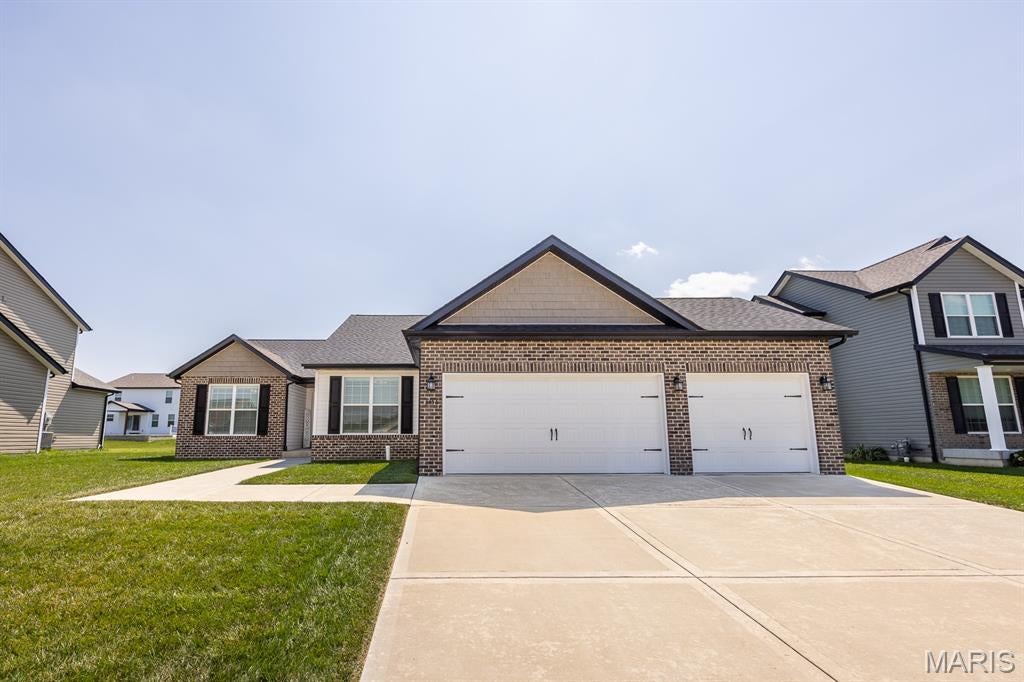 Situated in the heart of Shiloh with Shiloh Elementary+Middle and O'Fallon HS, this spacious ranch (BUILT IN 2022!) offers the main floor living you've been waiting for! Stepping inside, you'll fall in love with the vaulted living room featuring a cozy electric fireplace and beautiful plantation shutters. The equipped kitchen offers GRANITE COUNTERS and STAINLESS APPLIANCES. The primary suite is sure to WOW with vaulted ceiling, 2 closets (1 is a HUGE WALK IN), and en-suite bathroom (DUAL SINKS, SEPARATE SOAKING TUB & SHOWER, granite counters). Two additional nice sized bedrooms and full bathroom - granite counters here too! Main floor laundry is conveniently located right off the garage and features built in cabinets, drop zone, and closet. The finished basement offers even more space to spread out featuring 2 additional bedrooms (4th+5th), a 3rd full bathroom (you guessed it - granite!), and TONS OF STORAGE in the unfinished area. Out back, you'll love spending time on the beautiful covered patio and deck in the 6 FT PRIVACY FENCED yard - morning coffee, summer BBQs, you name it. And the HUGE 3 CAR GARAGE is plenty big for your vehicles and storage! Offering complete peace of mind, the roof, HVAC, and water heater are all 2022, and the home has been PRE-INSPECTED - report included in supplements with disclosures. All of this in the perfect location - minutes to Scott AFB with tons of shopping and restaurants close by. This home will be sure to check ALL of your boxes!