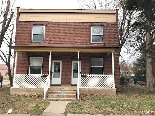 Two Story Duplex with Covered Front Porch, Wood Flooring in Main Living Areas, 14 x 13 Living Room Opens to 14 x 8 Galley Style Eat In Kitchen, Appliances Include Electric Range, Garbage Disposal and Refrigerator, 10 x 9 Dining Area, 14 x 14 Master Bedroom, 12 x 10 Second Bedroom, Full Hallway Bathroom, Partially Finished Basement Includes 10 x 9 Third Bedroom, Washer and Dryer Available, Lawn Service, Water and Sewer Included, Available 06/19/2026.