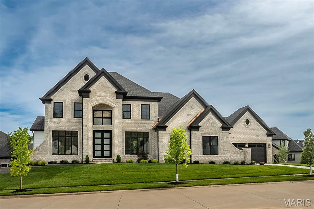 New Construction, Chesterfield, Rockwood Schools! MACNIFICENT 1.5 Story home with Finished Lower Level in a FABULOUS LOCATION! Crafted by St. Louis' premier hands-on builder, Claymont Development, LLC - Wesley Byrne. The WINGATE III is a spectacular 5BR, 4.5 bath with 5400 sqft of exquisitely finished Living space. Exterior features a warm blend of brick & stone; extensive millwork; the two-story entry foyer makes a striking first impression! Formal dining room with wainscoting and den/office on either side of the Foyer; two-owner's suite with dual closets. Three bedrooms, 2 baths, and bonus room complete the upper level. 10' main floor ceiling, 8' doors, 4-car garage; screened-in porch and deck overlooks common ground! Sensational LL includes brick/stone wet bar, huge rec-room, 5th bed & full bath.  Amenities include: onsite pickle-ball court, walking trail, common ground, & gazebo. Pictures of a previously built home. Tour is of the Display Home.
