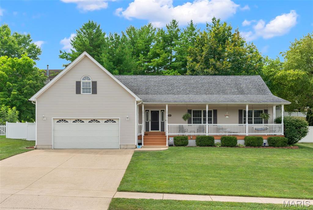 Welcome to 426 Windy Hills! For those of you that know and love this neighborhood, this house is located across the street from the lake. Top of the list of this home's many features is the stunning covered front porch. Imagine yourself having coffee or a glass of wine in the evening, listening to the sounds of the fountain from your front porch swing! The stairs and railing were recently replaced. As you come through the door, there is a generous landing spot for coats, shoes and keys. The large great room features a gas fireplace (think Christmas mornings) and beautiful wood look laminate floors that continue down the hall. This home was designed for maximum convenience in mind, everything you need is located on the main level with an easy, functional flow throughout. The bright and airy kitchen offers some newer appliances, newer flooring and a substantial amount of cabinets, including two see-thru, glass display cabinets over a breakfast bar. All the appliances will convey with the home. The main floor laundry is in a great location next to the garage w/ a second possible "drop-zone". The covered back patio offers a second, more private area, to get away from it all or for hosting friends and family. The backyard is already fenced for peace of mind & has a substantial concrete retaining wall. The primary bedroom is it's own sanctuary with a huge walk-in closet, private en suite & new carpeting. The secondary bedrooms provide plenty of room for family, guests or a home office each with tons of light from the front of the house & new carpeting. The lower level does have one room framed out and framing across the middle of the larger section. Let your imagination run wild. There is also shelving in the alcove for "ready-to-go" storage. This home has great flow, fantastic location and stunning features, make your appointment today. The home has already passed city occupancy inspection.