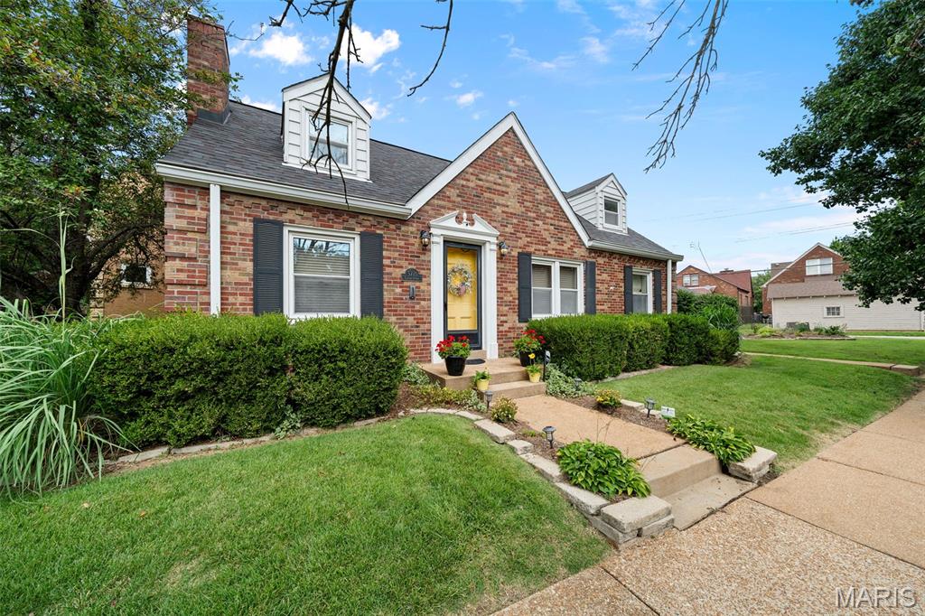 (c.) 1941: Fall in love with this charming Cape Cod on a quiet, non-through street in sought-after Lindenwood Park! Just a short walk to both Francis Park and Lindenwood Park, this 4-bedroom, 3.5-bath home blends timeless character with everyday comfort. Classic details include gleaming hardwood floors, art glass windows, crown molding, arched doorways, and an open living/dining area filled with natural light. The main-floor primary bedroom features a quaint nook and spacious closet, while a second main-floor bedroom makes an ideal office or guest room with nearby half bath. The bright kitchen offers abundant cabinetry, pantry, garden window, and all appliances stay! The conditioned sunroom is the perfect spot for morning coffee or evening wine. Upstairs you'll find two additional bedrooms, a full bath (one is a bed+bath suite combo), plus oversized closets. The squeaky clean lower level adds a spacious recreational space, full bathroom, separate laundry room, and ample storage. Outside, enjoy a beautifully landscaped, fenced backyard with a flagstone patio. RARE for the city is the ATTACHED 2-car garage + additional off-street parking. Walk to Trattoria Marcella, Skåld, Pint Size Bakery, parks, shops, Ted Drewes, Target, Schnucks, and more. This special home is ready to welcome its next owners!