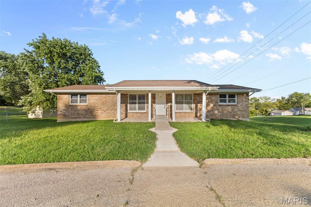 Welcome home to this well-maintained 3 bedroom 3 bath ranch style home in a great neighborhood near a park! The inviting main level you will find an open floor plan with living room that features large windows and a spacious kitchen plenty of cabinets and counter space. Large family room provides plenty of space to relax and gather and will also lead you to the expansive deck outside. The finished lower level offers an additional family room, weight room, storage area, laundry room, bathroom and utility room with access to one car garage. This home also features a one car attached garage plus an additional carport. Don't miss this opportunity to make this home your own!