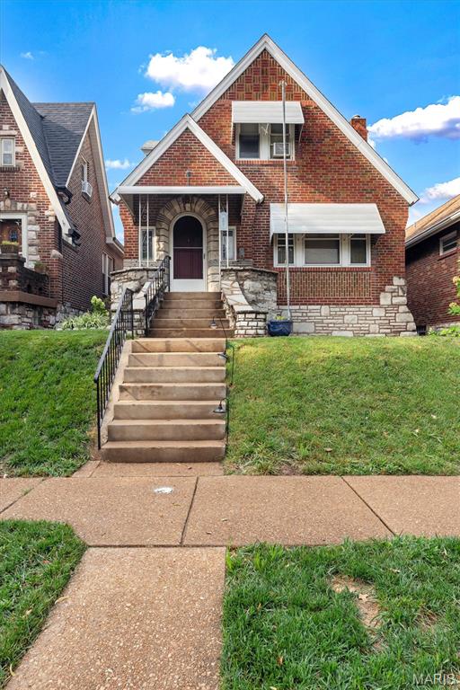 Charming Southampton Character | 3 Bed, 2 Bath | Detached 2-Car Garage

Packed with original architectural charm, this 1,500+ sq ft Southampton 1.5-story is ready for its next chapter. Highlights include arched doorways, coved ceilings, stained-glass windows, retro tile baths, and focal fireplace with unique surround.
The main level boasts spacious rooms with recently exposed beautiful hardwoods, original banister, doors, and glass knob. You'll enjoy the dining room large enough to seat 10 with a stunning period chandelier.  Primary bedroom is off the back staying shaded most of the day with great closet space. Yellow retro tile and arch shower make this main level full bath extra fun. The white tiled kitchen is bright and has natural light shining through that leads right to the sunroom room. This will quickly become your favorite spot for morning coffee. 
The upper level boasts 2 LARGE additional bedrooms and a full bath. These rooms need a little love but would nothing a little elbow grease and cosmetic work can't fix. A detached 2 car is off the back yard and you'll be impressed with the landscaping and privacy that this lot provides. PLUS a lower level that has SOME finish but plenty of space for storage, workbench, laundry and more. 
If you are looking for a SPACE + CHARACTER on the PERFECT Southhampton street. A few minor projects will win you some great instant equity.