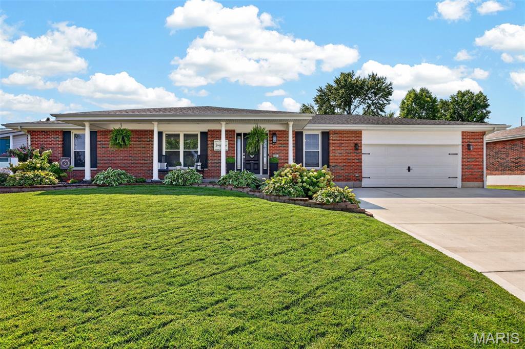 This gorgeous full brick home is an entertainers dream! Location, full renovation and amenities galore.  You'll immediately notice the beautiful hardwood floors, corner fireplace and open floorplan.  The main floor features a fully updated chefs kitchen complete with new appliances, cabinetry, granite countertops and stunning lighting to highlight it all.  There is a dining room off the kitchen ready for your holiday parties.  Down the hallway you will find 2 generous sized bedrooms and a tranquil primary bedroom with full ensuite and a walk in closet overlooking the lush backyard.  The lower level features a sleeping room with walk in closet, fitness lounge, cocktail tasting nook, rec room and a buffet wall of cabinets with specially wired wall outlets for all your potlucks.  The showstopper backyard oasis is sure to impress whether you are seeking a relaxing day at your private pool or hosting a pool party for friends and family, this setup has it all!  From hanging out on the covered patio dining and socializing to mixing up your favorite drink at the pool bar to jumping off the diving board for a cannonball contest or tanning in the sun this amazing setup is enhanced by a Sonos surround sound system and ambient lighting to keep the vibe going into the evening.