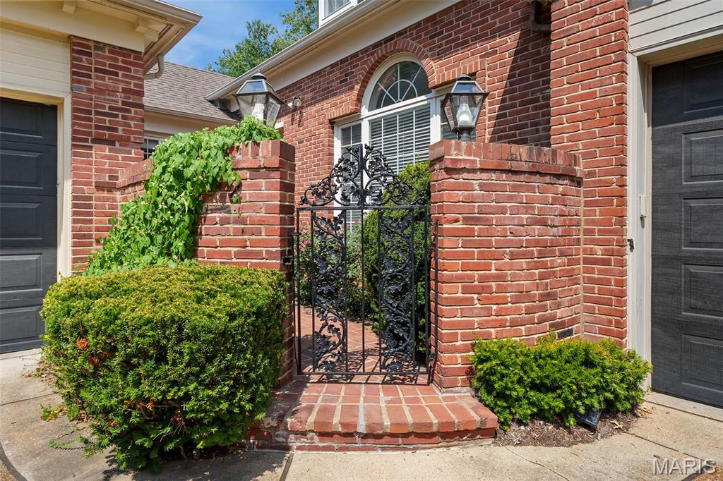 Elegant & sophisticated best describe this substantial villa located on sought-after Upper Price Road offering the very best location w/ all the modern & civilized amenities necessary for today's busy lifestyle.  Private courtyard with wrought-iron gate greats you as you enter the gracious foyer large enough to receive multiple guest at once. 10' ceilings, formal living room w/ wood flrs. and frplc., formal dining room w/ wood floors, great library/den off foyer w/ ensuite, full bath, newly updated kitchen w/ large, multi-level island with ample seating, gourmet, stainless steel appliances, custom cabinets & 2 pantries PLUS an adjoining family room w/ built-ins opens to HUGE, private terrace accessible from both the formal living room or the family room...great flow for entertaining on a large scale.  Extensive millwork, solid core doors & moldings through out.  Enjoy the 1st floor, very spacious primary suite w/ his & her dressing areas, large walk-in shower w/ frameless shower door, soaking tub, skylight & multiple walk-in closets.  Each bdrm on the 2nd flr. features an ensuite bath & walk-in closet ideal for guests.  Partially finished lower level w/ mirrored exercise room, a finished rec. room, half bath + plenty of storage.  Enjoy the very large, private, outdoor patio for entertaining, grilling, dining al fresco or just a morning cup of coffee.  Easy living just footsteps out of Ladue & Clayton and close proximity to 170 & Hwy 64 (40).