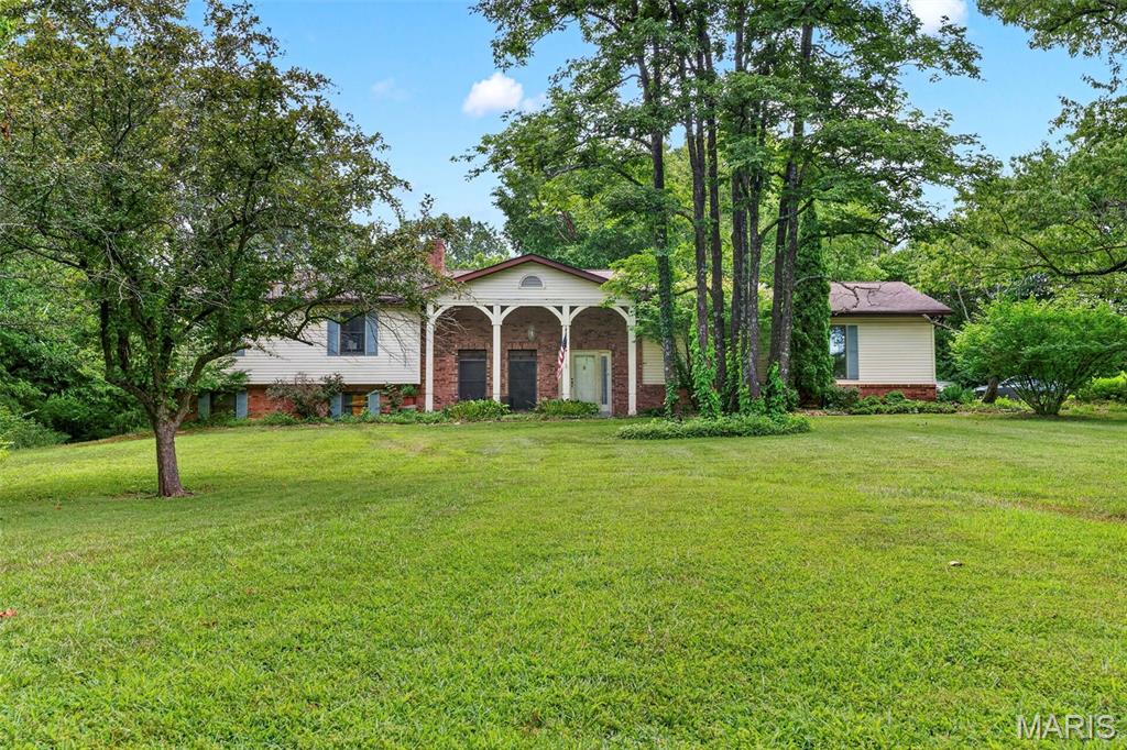 You’re going to LOVE this wonderful 3,100+ finished sqft home sitting on 2.09 acres on a quiet cul-de-sac! Inside you are welcomed by a beautiful fireplace that will keep you warm throughout the up coming fall/winter while you spend quality time in the walkout LL family room. There is a large 4th bedroom that is essentially an The LL also features a full bathroom with jet tub. Soaring ceiling features decorative beamed cathedral style vault. Up the spindled staircase you’ll find completely redone kitchen that boasts a built-in pantry and garbage cans, granite counter tops, & plenty of room to entertain guests during summer & holiday gatherings. A 17 x 16 family room off the kitchen provides a great place to unwind with plenty of windows offering tons of natural light. Head to the primary bedroom suite featuring an expansive walk-in floor to ceiling tiled shower, generously sized vanity & closet. Two more spacious bedrooms & a full bath complete the upper level giving you all the space you need to make this one the perfect home! The level private lot backs to large parcels of land providing a feeling of privacy and seclusion. The huge 30x48 detached garage wired with electic offers tall doors allows lots of room for large trucks or boats. Schedule your private showing today!