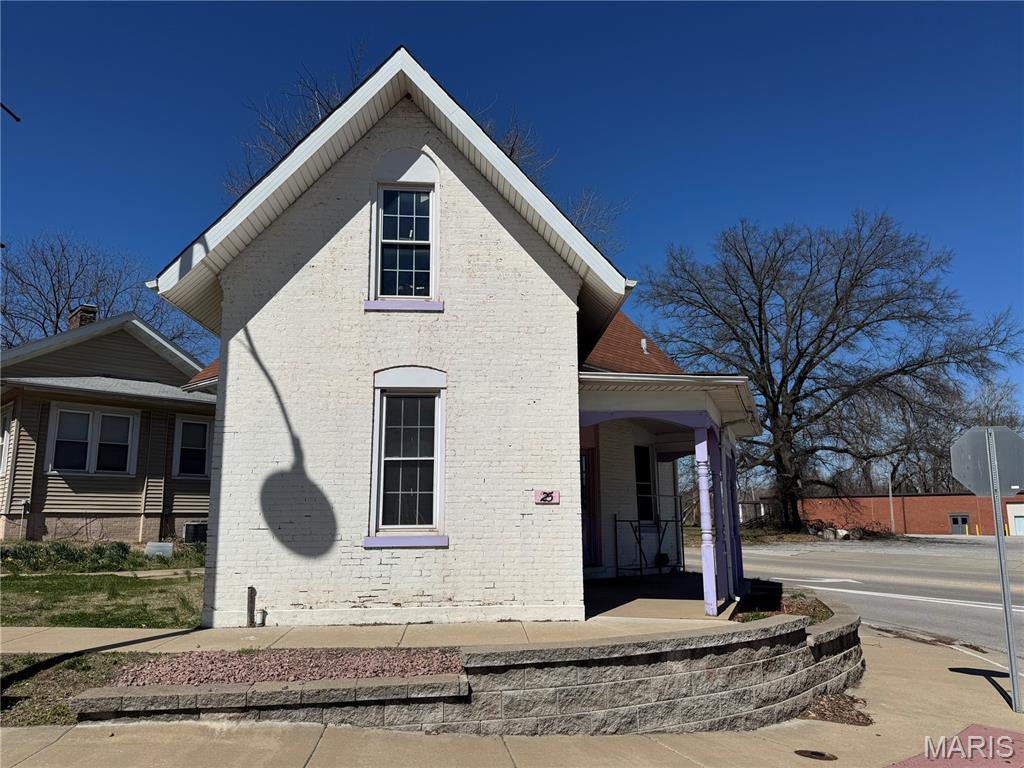 Position your business for success with this highly visible corner-lot property, offering excellent exposure to steady daily traffic. This historic all-brick building is full of charm and character, creating a unique and inviting space for your next venture.  Second parcel is a parking lot.

The main floor features two spacious open areas, ideal for retail, office, or service-based businesses, with flexibility to suit your needs. An open staircase adds architectural appeal and leads to the upper level, which includes a bathroom with shower and an additional room—perfect for storage, office space, or private use.

Whether you're launching a new business or expanding an existing one, this property offers the opportunity to bring your vision to life in a standout location.