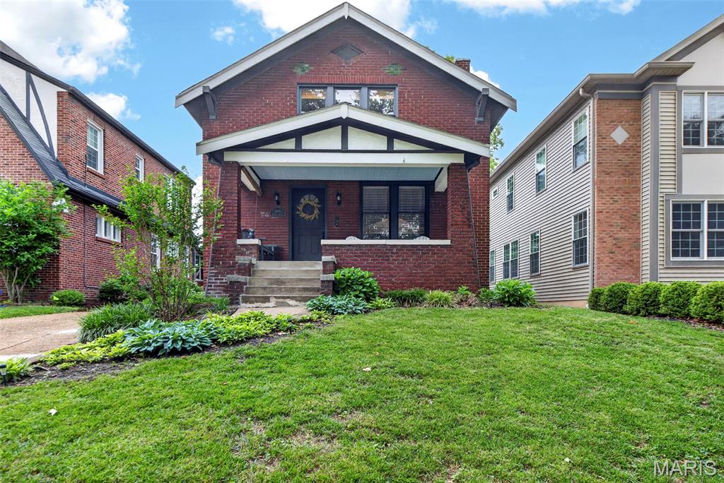 Open House Sunday 5/31 1-3. Absolutely darling University City bungalow! This 2 bedroom, 1 bath home blends that 1920s charm with thoughtful modern updates. Beautiful, newly refinished hardwood floors, original woodwork, stained glass windows and a cozy fireplace make this sweet house feel like home! The updated kitchen features granite counters, stainless appliances, an island and plenty of storage. The second floor offers two spacious bedrooms and a full bath. The laundry is located in the unfinished lower level which is clean, dry and ready for your finishes or storage needs. The detached 2 car garage is a real bonus! This adorable home is move-in ready, in a fabulous U-City location just steps from Joseph W Mooney Park and close to all the wonderful shops, restaurants and entertainment University City has to offer.