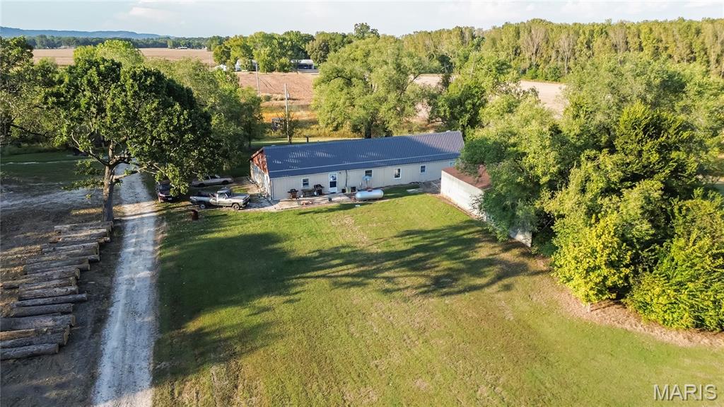 Tucked away on a quiet country road, this 8.8 acre property offers the peace and privacy you've been looking for. This property offers a perfect blend of income potential and outdoor recreation. The setting is full of wildlife and natural beauty-a perfect spot for your weekend getaway or future homestead. The existing 3 bedroom, 2 bath metal home will need significant TLC inside, giving you the opportunity to make it your own! There is also a two car attached garage and a 20'X70' lean to building. Whether you're looking for a place to renovate and live or a hunting retreat, this one has the right ingredients.