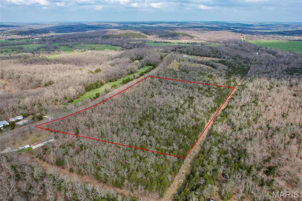 Dreaming of building your forever home? This beautiful 10-acre wooded tract offers the perfect blend of privacy, convenience, and natural beauty. With blacktop road frontage and a gentle, build-friendly slope, the property is ideally suited for a home with a walkout basement overlooking the trees. While utilities are not currently on the property, county water and electric are available and close by.  Nature lovers will appreciate being just minutes from the Osage Fork of the Gasconade River, where fishing, floating, and outdoor adventures await. Whether you're ready to build now or invest for the future, this peaceful acreage is full of potential!!