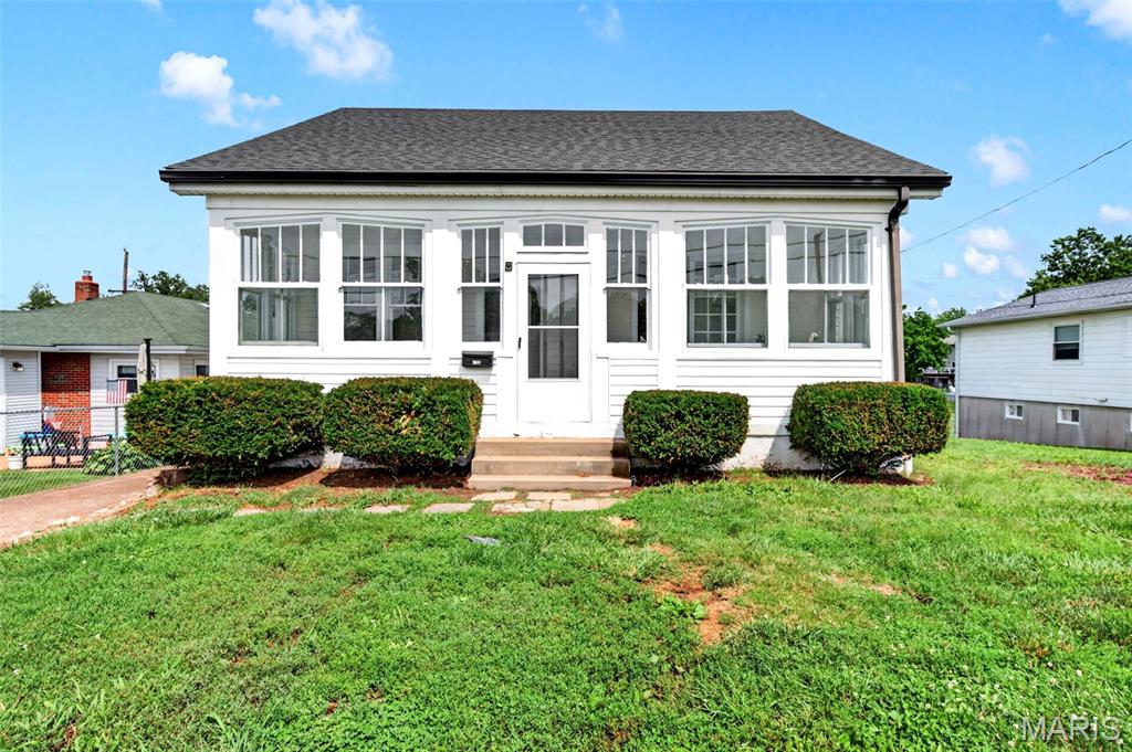 There is a distinct sense of ease that comes with a classic 1920s bungalow when it has been thoughtfully brought into the present. At this Affton-area home, the historic character remains, but the daily experience feels entirely fresh. It is an ideal fit for a first-time buyer or anyone seeking a manageable, stylish space where the heavy lifting of updating has already been handled.

Daily life centers around a main level grounded by durable, newly laid LVP flooring that flows seamlessly from room to room. The kitchen has been completely reimagined to serve as the functional heart of the house. With crisp quartz countertops, a new backsplash, modern black hardware, and brand-new appliances, it is a space designed for cooking and gathering without feeling closed off. Fresh paint across every wall, ceiling, and trim piece reflects the light, giving the entire home a bright, airy sensibility.

Upstairs, the bedrooms offer a quiet retreat, softened by brand-new carpeting that extends down the stairs. The home’s bathroom has been carefully refreshed with a newly finished surround and updated fixtures to make morning routines seamless.

The transition to the outdoors is just as inviting. The family room leads out to a spacious wood deck. Overlooking a generous backyard, the deck is made for slow weekend mornings with coffee or hosting friends.