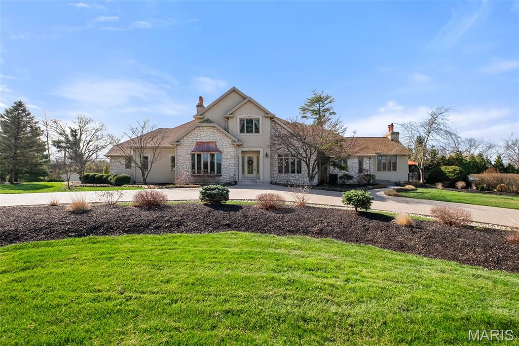 Continue to show -- will consider backup.  Come view this beautiful home at this newly adjusted price!!  28 Ladue Meadows is a custom built1.5 story  home offering versatility among quality finishes on a private 1.2 acre lot nestled in the heart of Creve Coeur! The floor plan brings in a main floor primary suite with a spa like primary bath and expansive walk-in closet which includes built-ins.  Top of the line finishes in the kitchen include Sub Zero refrigerator, Thermador gas cooktop, Thermador double ovens, Woodmode cabinets, stunning granite countertops and a Bosch dishwasher.  The kitchen center island and breakfast room space lead you into the inviting hearth room offering custom built-ins, exposed wood beams, a stone fireplace creating an irresistible spot to gather! Extend into the dining room with a butler style pantry area, or enjoy the main level family room area which offers a wet bar and gorgeous and private rear view!  Features that optimize this home also include an oversized 3 car garage complete with electric charging ports and new steel backed insulated doors, the main floor utility room with a separate exterior entrance and TWO staircases connecting spaces and amplifying the customized versatility  of this floor plan!  The main level office connects to a full hall bath and is considered in the bedroom count.  The above grade sq ftg is 5126 and combined sq ftg with finished lower level spaces brings you to 7026 square feet.  The 3 secondary bedrooms on the 2nd floor are nicely sized with one of those being an en suite and a Jack and Jill servicing the other two bedrooms.  The loft area outside the bedrooms provides a nice gathering spot/nook on the 2nd floor!  Move through to the lower level and find a designated work out room, a theater room/space, wet bar, craft/bonus room with plenty of storage space!  The quality remains evident in features such as refinished grey washed quarter sawn oak hardwood floors, steam shower and separate soaking tub in the primary bath, newer aggregate driveway, professional landscaping, a touch pad stereo system, maintenance free deck off the hearth room area, and a heated saltwater inground pool!  Convenient commutes and Parkway North schools add to the list of features this amazing opportunity offers!