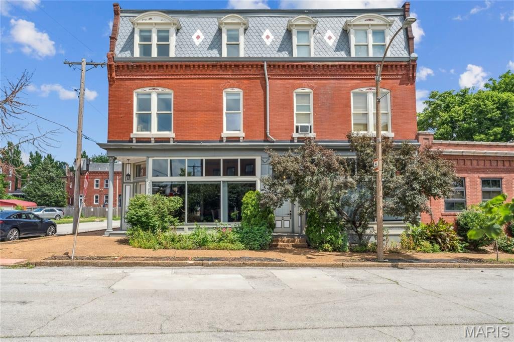 Welcome to historic Benton Park living at its finest! This stunning corner-unit 3 bed 2 bath condo in the coveted Indiana Condo building blends 1913 character with smart modern upgrades across two spacious levels.

The main level is an entertainer's dream, with a chef-ready kitchen featuring a large island flowing straight into the dining area and an expansive 24'5" x 13'9" living room, plus a private balcony off the dining space for your morning coffee or evening wind down. Just off the living areas you'll find a true owner's retreat, a primary suite spanning over 16' x 21' complete with a spa-style en-suite bath and a generous walk-in closet, all with the convenience of a main level laundry room and a bonus utility space. Upstairs, two more oversized bedrooms, share a beautifully appointed second full bath, giving everyone room to spread out.

Rich wood floors, ceiling fans, stone counters, a soaking tub, and a smart thermostat round out the interior, while central air keeps things comfortable year round. Outside, enjoy your private patio and the gated courtyard with a gas grill hookup, all wrapped in the timeless brick construction this neighborhood is famous for, plus gated secured parking for peace of mind. The HOA covers insurance, maintenance, sewer, trash, and water, so you can spend less time on upkeep and more time enjoying everything Benton Park has to offer.

Grab a morning bite at Benton Park Cafe & Coffee Bar just around the corner, savor fajitas and margaritas at Arzolas, or treat yourself to a memorable dinner at Frazer's Restaurant & Lounge or The Fattened Caf, all within walking distance. Tower Grove Park is a short drive away for farmers markets and green space, and downtown St. Louis with the Gateway Arch is just minutes away for a night out or a weekend adventure.

Homes like this in Indiana Condo do not sit around, so schedule your showing today and get ready to fall in love with city living, historic charm, and modern comfort all under one roof!
