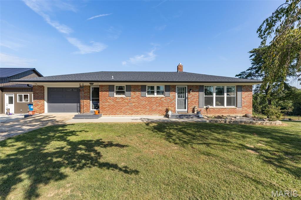 Updated all-brick ranch home on 1.5+/- level acres. Incredible 30x40 detached shop/garage, fully insulated, with its own 200-amp electrical box, garage door openers, AC & heat, and an office inside. It also features a wraparound covered overhang with can lights, a man door to the outside, and an attached finished office area with its own heat & AC and cathedral ceilings, plus a patio and deck area. There's an attached, oversized 1-car garage with entrances into the home and onto the deck.
Large kitchen with all appliances staying, including an oven with a built-in air fryer, and wood floors throughout. Full, finished walkout basement featuring a bar area, an additional craft or office room, a large bathroom, a family room, and a game room. Also includes 220-amp electrical boxes, a septic system with drainfield installed in 2020, and a roof from 2021. HVAC and windows are both energy efficient.
Updates between 2024 and 2026 include: 6-inch gutters added to the shop & house, a side-by-side stainless refrigerator, an electric oven with a built-in air fryer and flat top, a new microwave, rock added to the driveway & parking area, freshly painted columns, a fence with a gate entrance, newly installed attic access, tree cutting and removal, and a screened-in porch converted into an all-season room. The home was completely redone, and the shop was added, between 2020 and 2024. Close access to I-55 for added convenience.