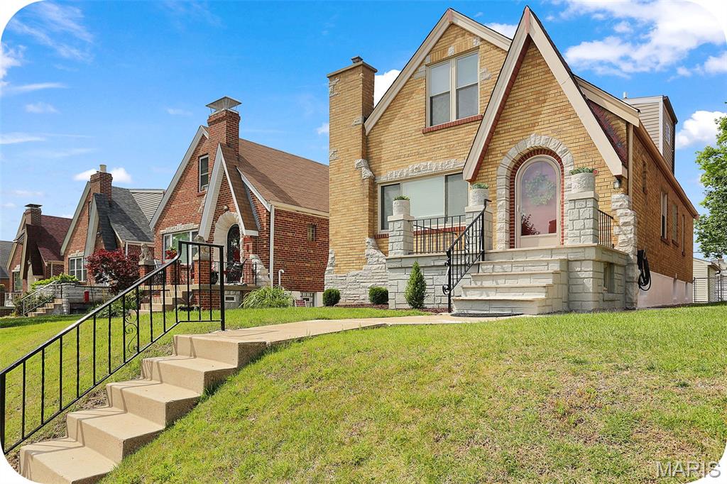 Dreaming of a home with character, great neighbors, and a location that makes it easy to get outside and enjoy life? This charming gingerbread has all that and more. Tucked on a quiet, tree-lined street, it's the kind of block where people actually know each other's names. And with Tilles Park just a short walk away, you'll have pickleball, tennis courts, walking paths, green space, and a splash pad practically in your backyard. Inside, you'll find gorgeous original hardwood floors, a cozy vintage fireplace, and all the charm that makes older homes so special. The formal dining room is ready for everything from holiday dinners to board game nights and brunches with friends. The updated kitchen is bright, cheerful, and functional—the kind of space that makes cooking feel a little less like a chore. Two bedrooms and an updated full bath are conveniently located on the main floor. Upstairs, you'll find two more bedrooms, a second full bath, and some seriously cool knotty pine paneling that brings all the vintage vibes. Need extra space? The finished basement delivers with a huge rec room that's perfect for movie marathons, a home office, workout space, playroom—or some combination of all four. There's also a third full bath, laundry area, and plenty of storage. Out back, the yard offers room for gardening, grilling, or simply enjoying your morning coffee, and the garage is the icing on the cake. If you've been waiting for a home that feels welcoming from the moment you pull up, this just might be the one. Skip the Zillow rabbit hole and reach out to me--the listing agent--directly for more information or to schedule a tour.