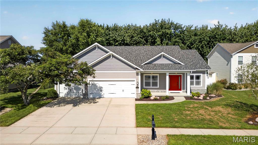 Presenting a meticulously maintained Craftsman-style ranch, offering 1,750 sq. ft. of well-planned, single-level living located on a cul-de-sac. Recently refreshed with a new roof (2026),  central air (2014), hot water heater(2024), stove (2020), dishwasher (2023), refrigerator (2020), electrical service: circuit breaker/fuses (2016), fresh paint, luxury vinyl plank (LVP) flooring, and new carpeting throughout, this 3-bedroom, 2-bath home is truly move-in ready. The open-concept layout features spacious living and dining areas, luxury vinyl plank flooring, and a welcoming fireplace that's perfect for gatherings. The gourmet kitchen, complete with a gas stove, is thoughtfully designed for both everyday cooking and entertaining. The spacious primary suite serves as a serene retreat with elegant coffered ceilings and a private en-suite bath. The full basement boasts 9-foot ceilings, two egress windows, rough-in framed walls, and a rough-in bathroom, offering limitless potential for future finishing. Outside, you'll find a 3-car garage and a level lot with mature tree lines and a 6-foot privacy fence, providing both tranquility and scenic views. Ideally located for convenient access to both Scott AFB and St. Louis, this beautifully updated home blends quality, comfort, and room to grow. Seize this exceptional opportunity before it hits the market!