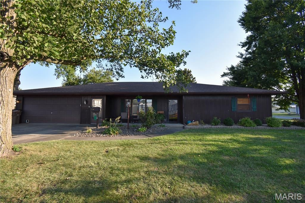 Step into style, comfort, and effortless one-level living at 310 W Mill Street, right in the heart of Staunton! Designed with both everyday living and entertaining in mind, this beautifully updated and exceptionally well-maintained 3-bedroom, 2-bath ranch features a spacious open layout that creates an inviting flow from the moment you step through the easy-access front door. The thoughtful floor plan provides comfortable, accessible living throughout. With everything conveniently located on one level, generously sized rooms, extra-wide hallways, 36-inch doorways, and an easy-entry garage, this home offers an easy-to-navigate layout that may be especially appealing to those seeking enhanced accessibility and wheelchair-friendly living. The home boasts three comfortable bedrooms and two full bathrooms, including a highly functional second bathroom and laundry room combination equipped with an extra-wide shower. The beautifully updated kitchen serves as the heart of the home, featuring striking dark cabinetry, ample space for meal preparation, and a seamless connection to the spacious dining area. From there, the expansive living room offers plenty of room to relax, gather, and make yourself at home.The story of this home continues outdoors, where relaxation takes center stage. Outside, enjoy a charming private reading nook—the perfect place to sip your morning coffee, unwind with a good book, or simply enjoy a quiet moment outdoors. A cozy 3-season sunroom opens directly onto a patio perfect for summer BBQs. Nestled on a generous, landscaped corner lot, the exterior also features a 10x18 shed with a rear potting area ready for your gardening projects. Beyond the property lines, the location writes its own perfect chapter. You are just a pleasant, easy stroll away from local restaurants, summer concerts in the park, and Staunton's beloved 4th of July parade. Combining updated finishes, spacious living areas, thoughtful design, and the convenience of single-level living, this home offers the perfect blend of comfort, style, and functionality. Don't miss your opportunity to make this beautifully maintained property your own!