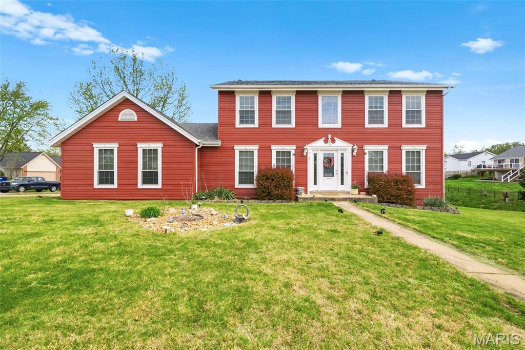 COMING SOON. Showings begin April 17. Looking for space, flexibility, and value in a sought after location? This well maintained 4 bedroom, 3 bath home with over 2,300 square feet sits on a desirable corner lot and offers an exceptional opportunity to make it your own, all within the Francis Howell School District. Designed for everyday living and entertaining, this home features multiple living areas, a finished lower level, and a layout that provides both openness and defined spaces. The inviting main level offers warm wood look flooring, abundant natural light, and a functional kitchen with ample cabinetry and a built in double oven, perfect for hosting or daily use. Upstairs you will find generously sized bedrooms including a large primary suite with private bath and a spacious walk in closet. The layout offers flexibility for family, guests, or work from home needs. The finished lower level adds valuable additional living space ideal for a recreation room, hobbies, or storage, including a bonus room that could be used for guests, office space, or additional sleeping area.
Enjoy a cozy fireplace, great natural light throughout, and a home that has been well cared for with solid features in place. Step outside to enjoy two rear decks, one accessed from the living area and another from the garage, offering great space for relaxing or entertaining. Conveniently located near shopping, dining, parks, and everyday amenities. Well positioned homes offering this much space and value tend to attract strong interest. Plan to schedule your showing as soon as it becomes available! Floor plans with measurements included at the end of photographs.