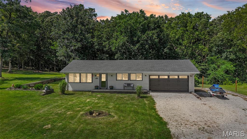 Have you been dreaming of owning your own piece of the countryside? Craving peaceful mornings, wide-open spaces, and room to truly breathe? Then your search ends here! Welcome to 4021 Lakewood Drive, where comfort, privacy, and country charm come together to create the perfect place to call home.

Nestled on a beautiful property surrounded by nature, this charming 3-bedroom, 1-bath home offers the perfect balance of cozy living and outdoor adventure. Whether you're a first-time homebuyer, looking to downsize, or simply ready to escape the hustle and bustle of city life, you'll appreciate everything this wonderful property has to offer.

Step inside and you'll immediately feel at home. The spacious living room welcomes you with an open, inviting layout that's perfect for gathering with family and friends. Picture cozy movie nights, cheering on your favorite team, holiday celebrations, or simply relaxing after a long day. The abundance of natural light creates a warm and welcoming atmosphere you'll love coming home to.

The kitchen is designed with both function and comfort in mind. Offering plenty of cabinet space for all your storage needs, generous countertop space for meal prep, and room for family dinners and entertaining, it's truly the heart of the home. Whether you're preparing a quick weekday meal or hosting Sunday dinner, this kitchen is ready for it all.

The three comfortable bedrooms provide flexibility for family, guests, or even a home office, while the full bathroom is conveniently located to serve everyone with ease.

But what truly sets this property apart is what awaits outside.

Step into your own private outdoor retreat where the possibilities are endless. Imagine starting your mornings with a cup of coffee while listening to the birds sing, spending afternoons exploring your own wooded surroundings, or ending the day watching breathtaking sunsets under a sky full of stars. The beautiful level yard provides plenty of room for children and pets to run and play, gardening, outdoor games, or simply enjoying the peaceful surroundings.

If you've always wanted space for bonfires, family gatherings, outdoor entertaining, or just a quiet place to unwind, you'll absolutely fall in love with this property. The combination of mature trees, open green space, and the serenity of nature creates a setting that's becoming harder and harder to find.

Whether you're looking for a place to slow down, reconnect with nature, or simply enjoy the freedom that comes with owning land, 4021 Lakewood Drive delivers. Here you'll enjoy the privacy and tranquility of country living while still being conveniently located near everyday amenities, giving you the best of both worlds.

Opportunities like this don't come around often. If you've been waiting for a home that offers peaceful living, room to roam, and the chance to create the lifestyle you've always dreamed of, this is it. Come experience everything 4021 Lakewood Drive has to offer, you may never want to leave!