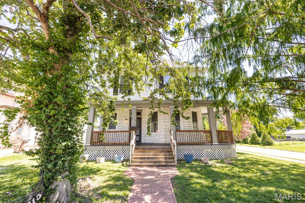 Welcome to a historic property where space is never an issue, perfectly located just a short distance from everything downtown has to offer! With an impressive two-story layout featuring nine total rooms and over 2,000 square feet of living area, this home maximizes every inch of its footprint. The main floor offers a sprawling layout highlighted by gorgeous luxury vinyl plank floors, a large dining space, and an incredibly oversized kitchen complete with a massive center island—ideal for meal prep and effortless entertaining. The upper level is dedicated to rest, featuring a full bath and four oversized bedrooms finished in cozy carpeting. This home delivers unmatched space and a prime location inviting you to make it your own!