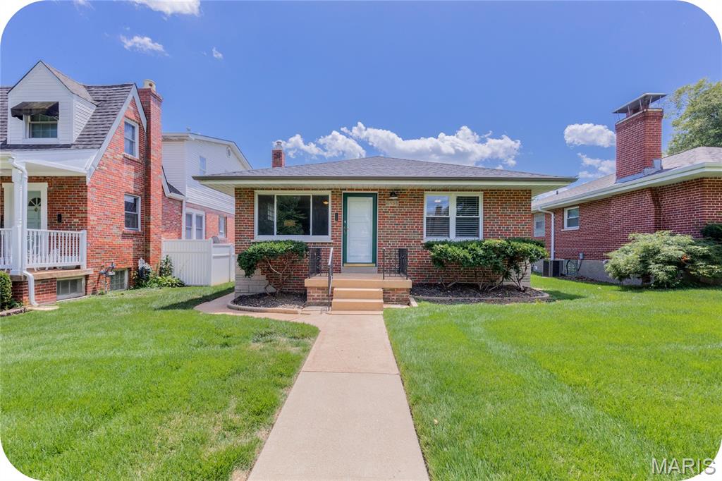 OPEN HOUSE SUNDAY 7/26 1-3! This adorable brick bungalow is located in the heart of Lindenwood Park on one of the best streets in the city-- surrounded by large lots, mature trees and tons of character! Walking distance to so many south city favorites like Trattoria Marcella, Blue Print Coffee, Donut Drive In, Ted Drewes, Lindenwood Park, and so much more! You'll love the open living/ dining room and original hardwood floors! The updated kitchen features warm cabinets, SS appliances and lots of natural light. Two good sized bedrooms and a full bath fill the rest of the main level. Out back is an amazing screened in porch-- perfect for enjoying morning coffee the rest of summer and all of fall. The basement is a blank slate with plenty of room for extra living space + storage. A large fenced in yard, big patio and garage make this place the whole package!