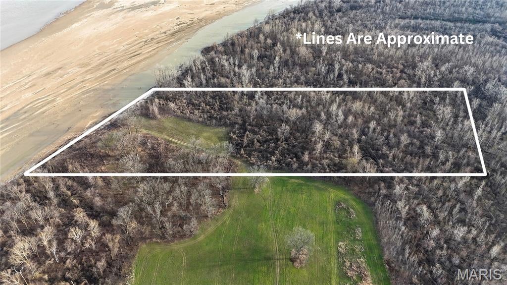 This 13-acre parcel sits directly along the banks of the Mississippi River, completely enveloped by Missouri Conservation Department land. The acreage features a balanced mix of open ground ideal for strategic food plots, leveraging the vast surrounding timber to attract trophy deer and wild turkeys. Direct river frontage provides immediate access for waterfowl hunting, fishing, and boating. Offered as a standalone prime recreational property or as a seamless expansion to Tract #1, this parcel is to be sold as-is.