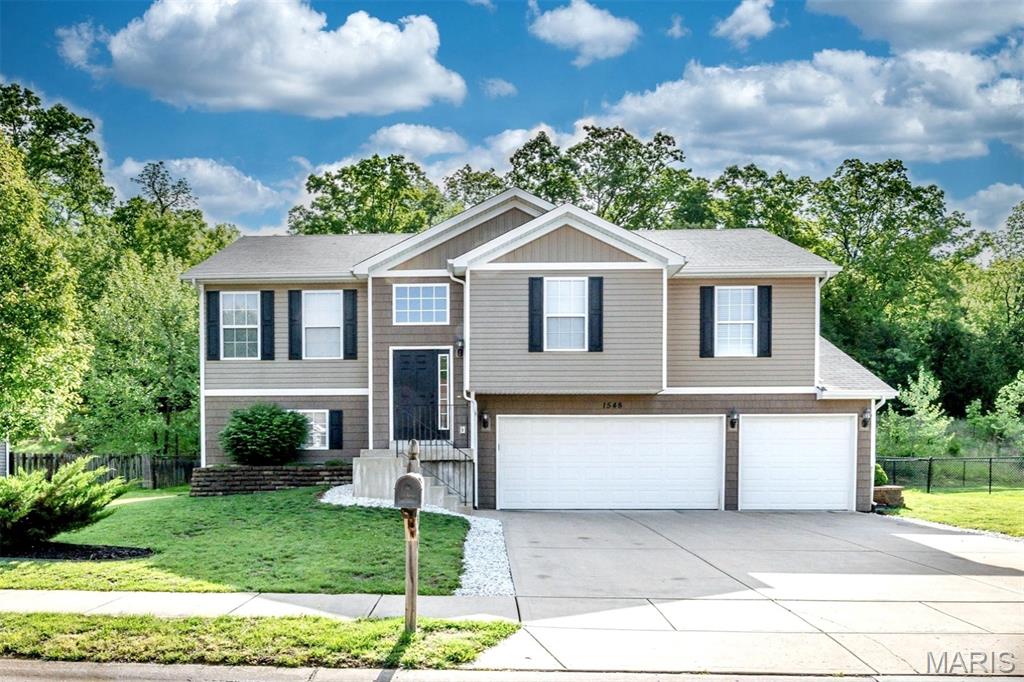 This beautifully maintained 3-bedroom, 2 full bathroom home offers the perfect combination of comfort, style, and functionality in a highly desirable subdivision. Featuring a spacious 3-car garage and an open, inviting layout, this home is ready for its next owners.

The kitchen area includes a convenient pantry and walks out to a 15-foot-wide deck overlooking the fenced backyard — perfect for entertaining, relaxing, or enjoying your morning coffee. Bamboo flooring flows throughout the main living areas upstairs and continues into the basement, adding warmth and durability throughout the home.

The spacious primary suite measures 16x12 and features bamboo flooring, a full private bathroom, and a walk-in closet. Two additional bedrooms and another full bathroom provide plenty of room for family, guests, or a home office setup.

Located in a beautiful subdivision with a welcoming neighborhood feel, this home offers the space, updates, and features buyers are looking for. Don’t miss your opportunity to make this one yours!