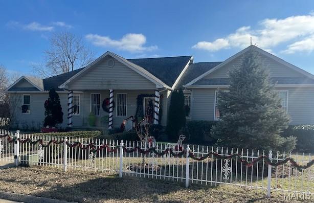 First time on the market.  Beautiful 5 bedroom, 3.5 bath open concept ranch-style home that will wow you.  This home has over 2500 Sq Ft living space with: large living room, open concept kitchen with all stainless appliances, large bar, vaulted ceilings, formal dining room, split bedroom floor plan.  Master suite is on west side.  Utility/laundry room, 4 bedrooms and 2 baths on east side.  Wood flooring throughout.  Custom cabinetry,  security doors and windows.  2 central H&A units, 2 car garage and large fenced yard on a corner lot.  Most furnishings with stay with the home.