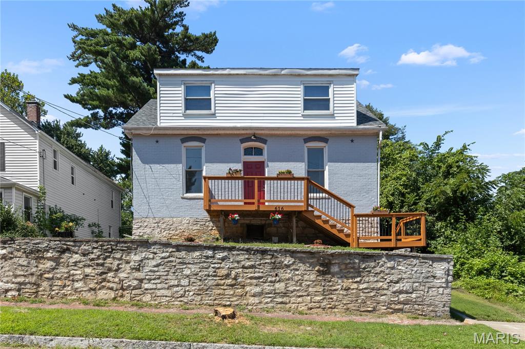 Discover this beautifully renovated piece of Alton history,  built in 1891, story and a half home that perfectly blends charm and modern comforts. Featuring three spacious bedrooms and two full baths, this property has been fully updated with a new HVAC system, roof, and a tankless hot water heater. As you step inside, you’ll be greeted by stunning new flooring and gorgeous granite countertops paired with stylish new cabinets. The main floor boasts a serene primary bedroom with an en suite bathroom, complete with a dual vanity and walk-in shower. Additionally, the inviting living area includes a cozy electric fireplace and offers flexibility to be used as a fourth bedroom if desired. Out back you will find a brand new deck and a spacious back yard. All you have to do is move right in! Nothing to so for years! This is a must-see gem!