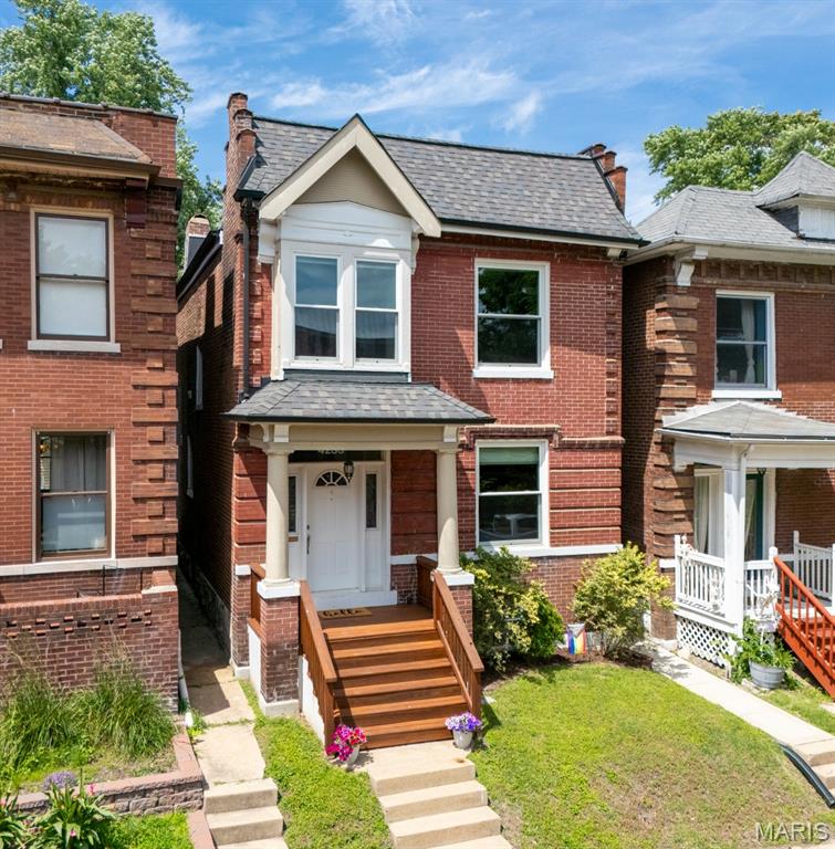 Historic charm meets modern convenience in this beautifully remodeled home located in the sought-after Shaw neighborhood. Enter from the covered front porch to enjoy the stunning hardwood floors throughout the main level.  Rich in character, this residence showcases original millwork, original architecture and a huge window as you are welcomed into the living room.  (Fireplace in living room is non-functional)  Continue into the dining room which opens to the custom chef’s kitchen. Here you will enjoy plentiful custom cabinetry, stainless appliances, granite counters and a bar-height island.   Upstairs is a primary suite waiting for you at the end of the day – a private retreat, featuring a luxurious custom bath and generous walk-in closet. The second level offers 2 secondary bedrooms, one of which offers a custom office build - perfect for remote work or creative pursuits,  but can also be easily removed for a third bedroom.  This floor is completed by a full remodeled hall bath and laundry facilities.    

Head outside to discover a private backyard oasis fully enclosed with privacy fencing and featuring a deck (deck area wired for hot tub - hot tub does not stay), custom patio, and built-in firepit.  This is exceptional low maintenance outdoor living - not a detail was missed!  Beyond the yard is a two-car garage port providing valuable sheltered off -street parking.   Within walking distance enjoy Tower Grove Park with walking paths, a Saturday farmers market, yoga classes & more, Mo Botanical Gardens, Coffee Shops, Restaurants and many other venues!  Come visit 4233 Botanical Avenue – your new home is waiting for you!  Note:  Offers will be presented as received.