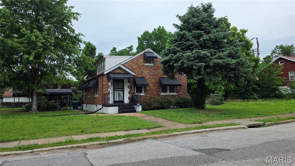 Welcome to this classic 1.5-story brick home situated on a spacious corner lot in Northwoods. Perfect for a buyer ready to customize and build equity, this property offers a highly functional layout featuring two bedrooms and a full bath on the main level, and an additional two bedrooms and full bath upstairs. 
Recent updates give you a fantastic head start, including a refreshed kitchen, an updated main-level bathroom, brand-new flooring, and a newly upgraded electrical panel for total peace of mind. Enjoy your morning coffee on the cozy enclosed porch, stretch out in the full basement, or take advantage of the generous yard space, ideal for outdoor entertaining and play. Complete with a convenient carport, this property is a fantastic opportunity to move right in and make a house your home.
Buyer to verify schools. Showings by appointment only; please wait for confirmation.