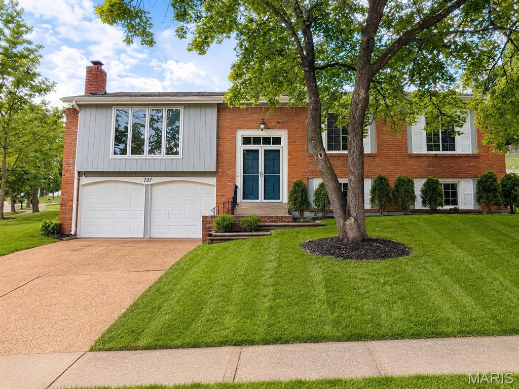 Welcome home to this beautifully updated 4-bedroom, 2.5-bath split-level in the sought-after Country Lane Woods subdivision! Freshly painted inside and out, beautiful flooring, this move-in ready home offers the perfect blend of style, comfort, and convenience. The updated kitchen features modern finishes including granite counters and stainless steel appliances.  Dishwasher new in '25, gas range, tile backsplash, ceramic tile floor, and newer atrium doors lead to the stamped concrete patio.The bathrooms have been tastefully renovated. Vaulted ceilings create an open, airy feel. The primary bedroom includes a full bath and a walk in closet. Generously sized bedrooms provide comfortable living for family and guests alike. The fenced and landscaped backyard is perfect for play and parties. Enjoy the mature trees, expansive common ground, and neighborhood green space that make Country Lane Woods such a desirable place to call home.  For added peace of mind, an Assurant Enhanced Home Warranty is included! Located in the highly regarded Parkway South School District and served by Carman Trails Elementary, this home also offers exceptional commuter convenience with quick access to major highways, making travel to downtown St. Louis, Clayton, Chesterfield, and West County a breeze. Don't miss this opportunity to own an updated home in one of West County's most established and convenient neighborhoods!
