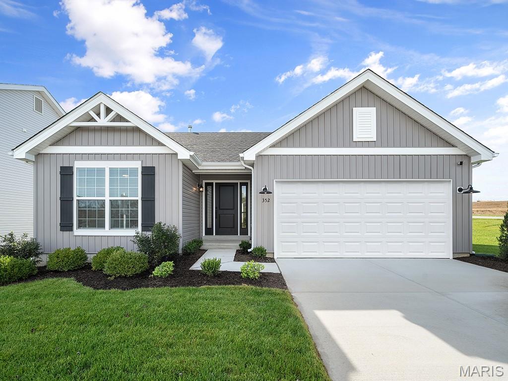 New McBride Homes Aspen ranch 3 BR & 2 BA, available this winter! Farmhouse exterior! Experience an open floor plan with vaulted ceilings, great room with a ceiling fan & wood laminate flooring in the main living area. The kitchen has level 4 Benton Painted White 42” tall kitchen cabinetry, quartz countertops, peninsula w/flush breakfast bar for additional seating, & stainless GE appliances. The primary suite has a walk-in closet, & private bath with a double sink vanity & 5’ walk-in shower. 2 extra bedrooms & full bath add convenience. Other extras include 6’ windows, ceiling fan prewires, main floor laundry, garage coach lights, & white 2 panel interior doors throughout. Plus a ¾ bath rough in at lower level. Located in House Springs, this community features 263 homesites off Bear Creek Road, just east of Gravois Road and Carol Park Road. Enjoy peace of mind with McBride Homes’ 10 year builders warranty & incredible customer service! Similar photos shown.
