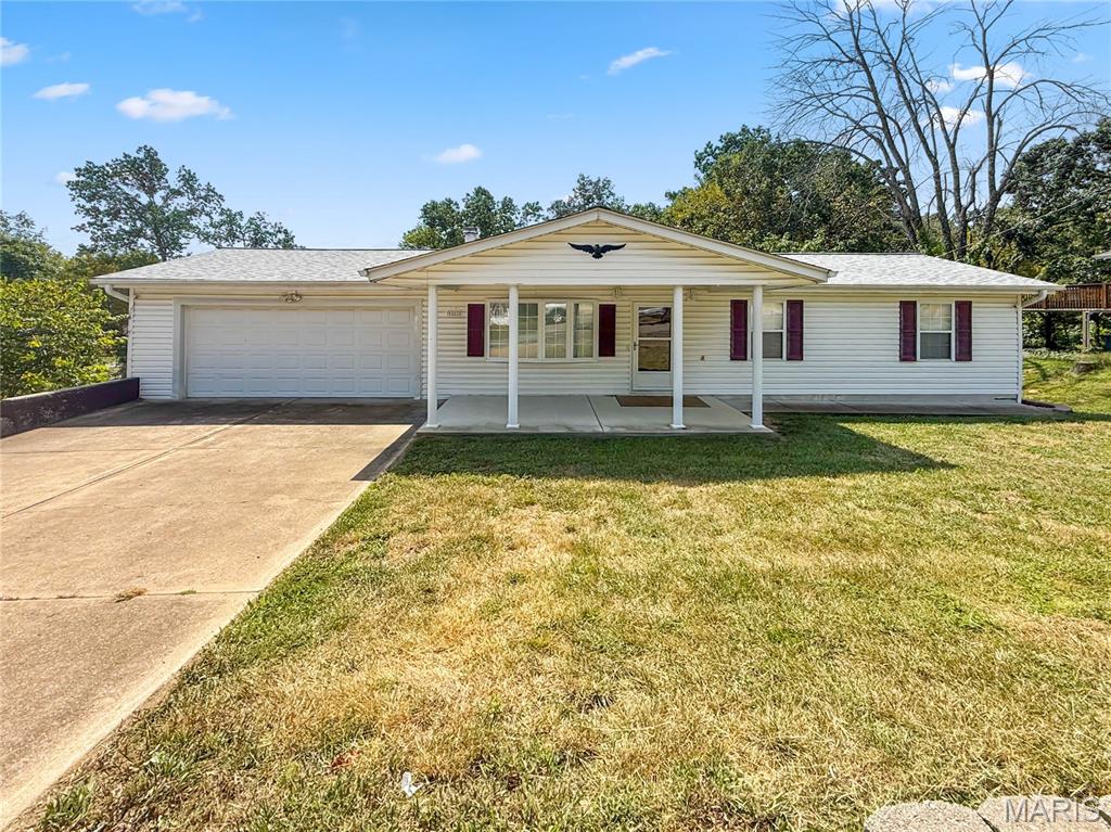 Space, privacy, and versatility come together in this beautifully maintained Pevely home situated on nearly half an acre. Offering over 1,600 square feet of finished living space, a private backyard, multiple outdoor living areas, and exceptional garage and storage space, this home has been thoughtfully cared for and offers plenty of room to make your own. The main level welcomes you with a comfortable living room and kitchen, along with three bedrooms and a full bathroom. Step outside onto the large deck overlooking the private backyard, creating the perfect setting for morning coffee, summer evenings, outdoor dining, or entertaining friends and family. The finished walkout lower level adds even more space to spread out with a recently updated family room, second full bathroom, and laundry room. A large storage room and workshop provides valuable space for projects, hobbies, tools, or additional storage. From the lower level, walk directly out to the covered porch and backyard, giving you another inviting place to relax and enjoy the nearly half-acre setting. Garage space is another standout feature, with a large two-car attached garage plus an additional garage on the lower level, ideal for an extra vehicle, lawn equipment, recreational toys, a workshop, or storage. This home delivers the space and flexibility you've been looking for.