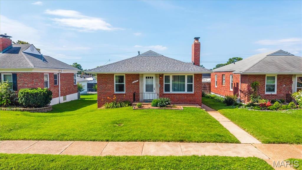 Welcome home to this charming North Hampton gem! Beautifully maintained with true pride of ownership, this move-in ready home sits in one of St. Louis’s most desirable neighborhoods and is just steps from the vibrant Macklind District — perfect for walkable dining, shopping, and entertainment.
Step inside to a bright, spacious living room anchored by a stunning historic wood-burning fireplace, creating the ideal setting for relaxing or entertaining. The updated kitchen features crisp white cabinets, sleek stainless steel appliances, and stylish flooring that makes every meal prep a pleasure. Just off the kitchen, the delightful sunroom is flooded with natural light — the perfect spot for your morning coffee or a quiet retreat.  
Gleaming hardwood floors flow throughout the main level, leading to two generously sized bedrooms and a stylish, updated full bathroom. Newer windows throughout the home provide excellent natural light and energy efficiency.
Need more living space? The finished lower level adds over 500 square feet of versatile living — ideal as a family room, home office, or entertaining man cave.
Outside, enjoy a fully fenced backyard with a spacious patio perfect for grilling and gatherings, plus plenty of green space for play or gardening.
This home offers incredible ease of ownership with a newer roof, updated mechanical systems, and a newer washer and dryer that stay with the property.
Don’t miss your opportunity to enjoy city living in style in this North Hampton beauty!