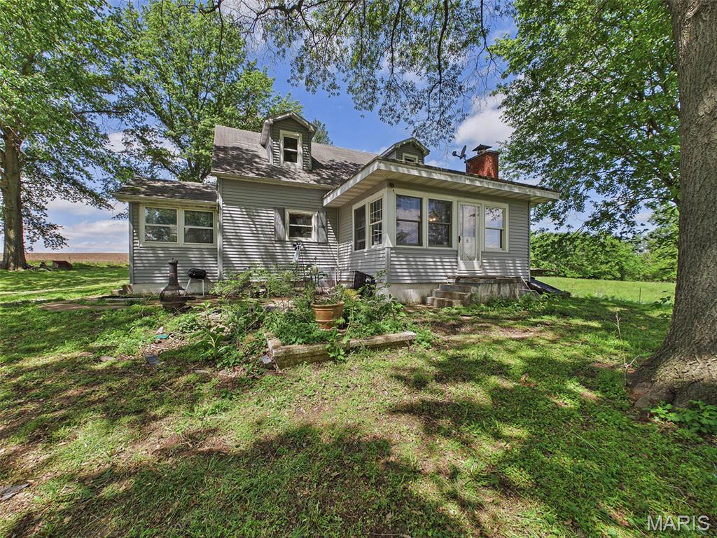 Country living with room to breathe! 3941 Gun Club Road in New Athens is just 15 minutes from SAFB and 45 minutes from STL. It offers a peaceful rural setting with privacy and open views ideal for relaxing, entertaining, and enjoying the outdoors, with town conveniences just a short drive away. Highlights of this property include a 3.08 acre pasture, .4 acre pond all set around a house and homestead area. Home, garage and all outbuildings sold in "as is" condition.  Seller to make no warranties, repairs, or perform an occupancy inspection to secure an occupancy permit.