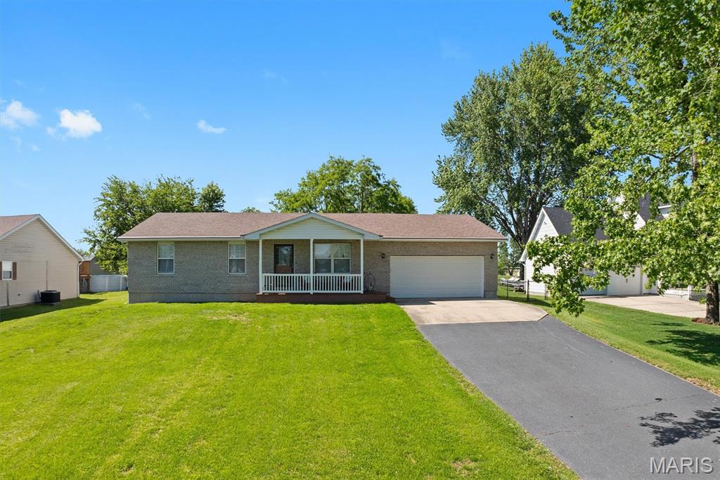 Welcome to 1231 Bahamas Drive in the desirable Holiday Shores Community. This beautifully maintained 3 bed 2 bath home has been lovingly cared for by the same owners for over 25 years. Enjoy the open floor plan filled with natural light, vinyl plank flooring, updated bathrooms and SS appliances included. The oversized mudroom/laundry area off of the garage features a huge walk-in pantry for added convenience. You will never run out of parking for family & friends with the double car garage and long driveway. Relax on the covered composite front porch or entertain on the spacious back deck. The full unfinished basement offers endless storage or future finishing possibilities. Updates include garage door 2024 front door sliding glass doors HVAC 2016 roof 2019 water heater 2021 Don't miss your chance to enjoy lake community living with amenities designed for relaxation & recreation.