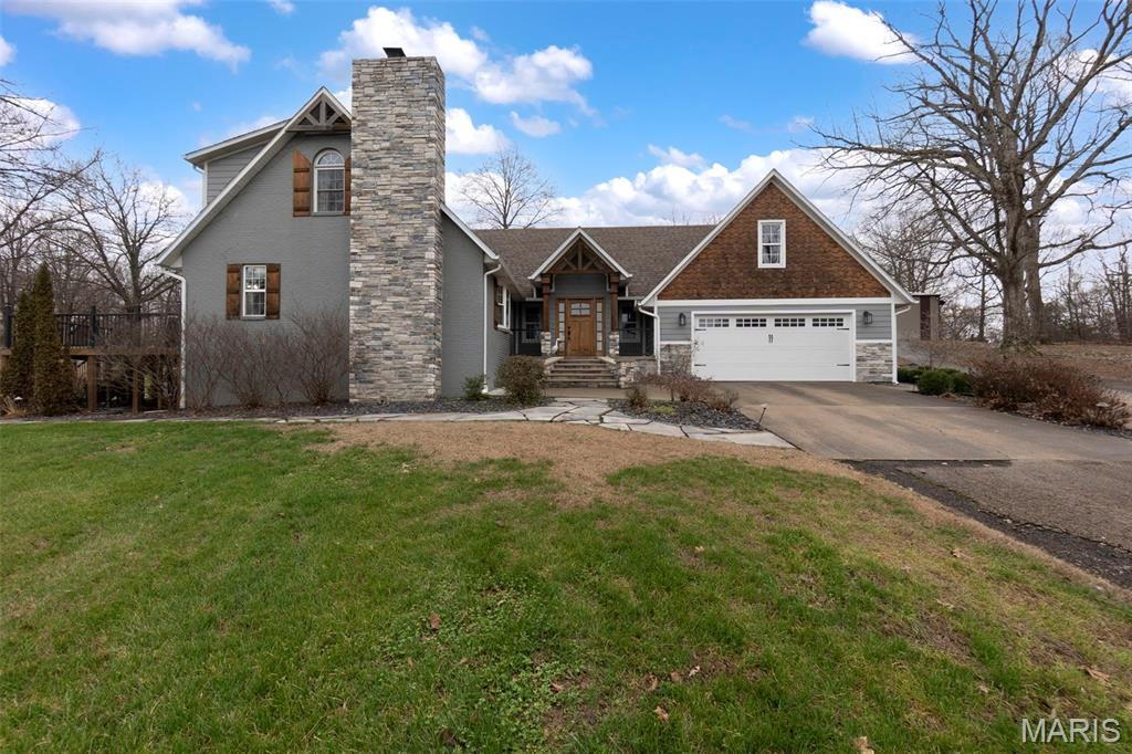 Some homes stand apart—this one sets its own standard. 

From the moment you arrive, the curb appeal draws you in and hints that life here moves at a more comfortable pace. Extensive landscaping frames the home beautifully, with mature trees surrounding the setting and creating a sense of privacy and calm. A stone walkway and welcoming front entry make coming home feel like the best part of the day.

As you step inside, the foyer opens into a bright, comfortable living room with wood floors, shiplap accents throughout the home, and plenty of space to stretch out or gather together. Custom built-in cabinetry anchors the space while keeping things tidy, and just off the living area, an office nook offers a convenient spot to work, study, or manage daily to-dos without feeling removed from the heart of the home.

The kitchen connects seamlessly to the rest of the home and quickly becomes the center of everyday life. Thoughtfully designed for both function and style, it features quartz countertops, custom cabinetry, a farmhouse sink, and a beautiful tile backsplash. Generous prep space makes daily routines effortless, and having—not one but two ovens—means holiday meals don’t feel rushed.

Just beyond, the dining area is wrapped in expansive windows. It’s the spot where mornings start slowly, dinners last a little longer, and conversations linger. Doors open easily to the composite deck and large patio when the weather’s right.

The main-level primary bedroom is a true retreat and has been recently updated. A bay window brings in peaceful views, while the attached bathroom features a clawfoot tub and a walk-in glass shower, creating a spa-like space designed for comfort today and practicality for the future.

Upstairs, three additional bedrooms and two full bathrooms provide flexibility, including one bedroom designed as a second primary-style suite. The bonus room over the garage adapts easily to whatever life needs and is equipped with a mini-split system for year-round comfort. Updates throughout the upper level blend naturally with the rest of the home, remodeled in 2018.

Downstairs, the partially finished basement serves as a playroom on one side, and laundry and storage on the other. A sump pump and professionally-sealed basement provide added peace of mind.

Outside, the land quietly sets the stage. With over 25 acres—much of it wooded—the setting offers privacy, calm, and room to explore. Trails wind through the woods, and a small older cabin tucked deep among the trees offers potential as a creative pet project. Abundant wildlife, including deer and turkeys, pass through the property, adding to the natural experience.

Set on the hillside behind the home, the 40x60 shop sits to the right, with custom cabinetry, a built-in bar, propane heat hookup, and electric A/C. A large Mennonite-built playset rests to the left, while an in-ground trampoline adds to the backyard fun.

And then there’s… the pool.

This is where summer unfolds. Long afternoons turn into evening gatherings, weekends feel like vacations, and everyday life slows down. Fenced for peace of mind and finished with a saltwater system, the pool feels like a private retreat that draws everyone together.

Major mechanical updates in the home include a gas water heater, furnace, A/C unit, and water softener, all replaced in 2022. Door sensors, a door camera with a touchscreen pad located in the living room, and a satellite internet hookup are already in place, adding modern convenience and connectivity.

And with a recent appraisal matching the asking price, this property is truly an exceptional opportunity in Dexter!

Altogether, this is a home where comfort, space, and everyday living come together naturally. Nothing feels forced. Everything feels ready to be lived in.

It’s easy to imagine staying longer than planned. And even easier to imagine calling it home.