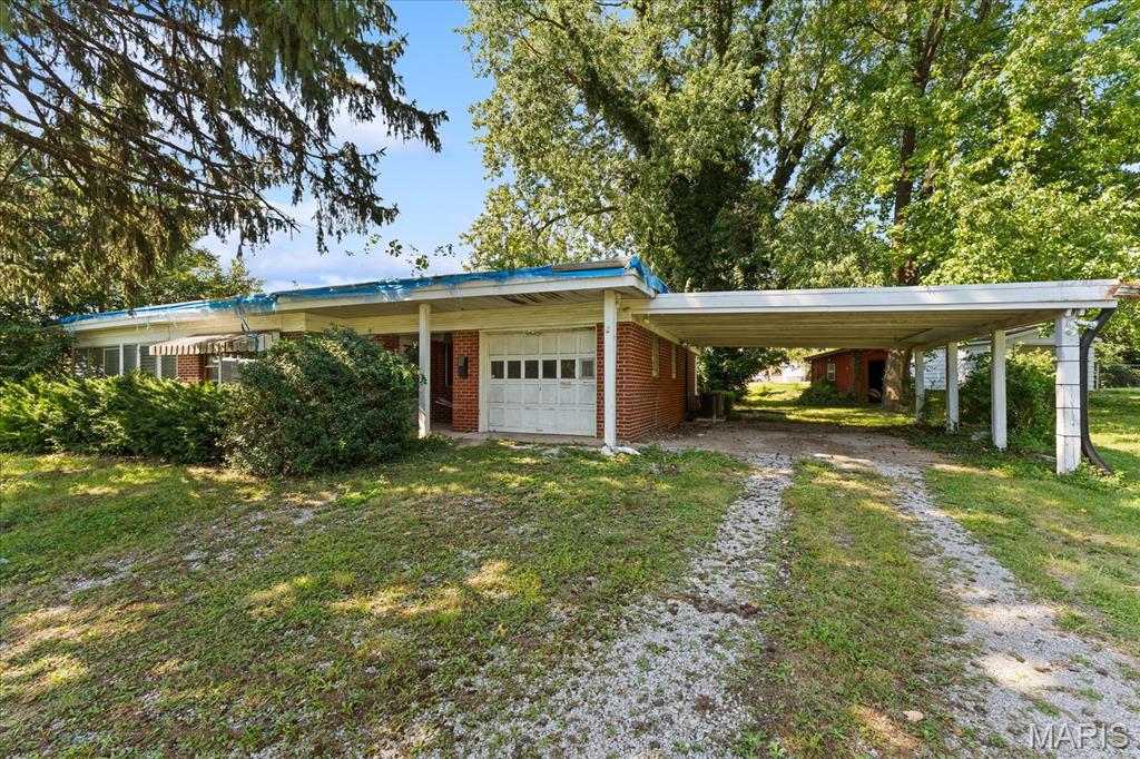 Mid-Century Modern Fixer-Upper on a Large Corner Lot!

2 Notre Dame Hill in Belleville offers a unique opportunity for investors, rehabbers, or buyers looking to bring a distinctive mid-century modern home back to life. Situated on a large corner lot, this all-brick property features several cool architectural elements and an attached garage.

The home is currently configured as a 2-bedroom, 1-bath residence but offers excellent potential to be renovated into a 3-bedroom, 2-bath home. The covered back patio provides additional outdoor space, while the large lot offers plenty of room for future improvements.

This property is in need of significant repairs and is being sold in its current condition. The flat roof will need to be replaced, and the living room ceiling is currently deteriorating. There are also visible signs of mold on the walls. Buyers should be prepared for a substantial renovation and are encouraged to conduct their own inspections and due diligence.

Conveniently located in Belleville School District 118 and close to shopping, restaurants, and everyday amenities, this property could be an excellent opportunity for the right buyer to restore its unique mid-century character.

IMPORTANT: All showings require a signed Hold Harmless Agreement prior to entry. Buyer and buyer's agent to verify all measurements, information, condition, and other property data. Property is being sold as-is.