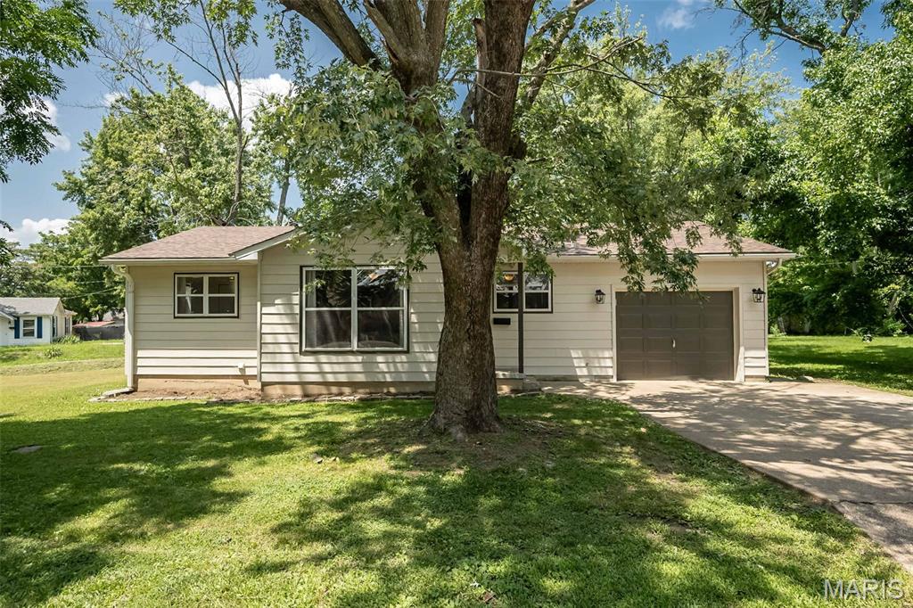 OPEN HOUSE CANCELLED - UNDER CONTRACT. The cutest, most charming updated 2 bedroom home in a convenient location close to parks, shopping, dining, and more! Step inside to a spacious, freshly painted living room that welcomes you in. Just off the living room are two generously sized bedrooms and a beautifully updated full bath. The charming eat in kitchen offers plenty of space for everyday meals, while the convenient main floor laundry adds to the home's functionality. With a freshly painted exterior and modern updates throughout, this home is the perfect blend of cozy charm and style. Situated on a corner lot, you'll also love the oversized attached garage with plenty of room for parking, storage, or hobbies!