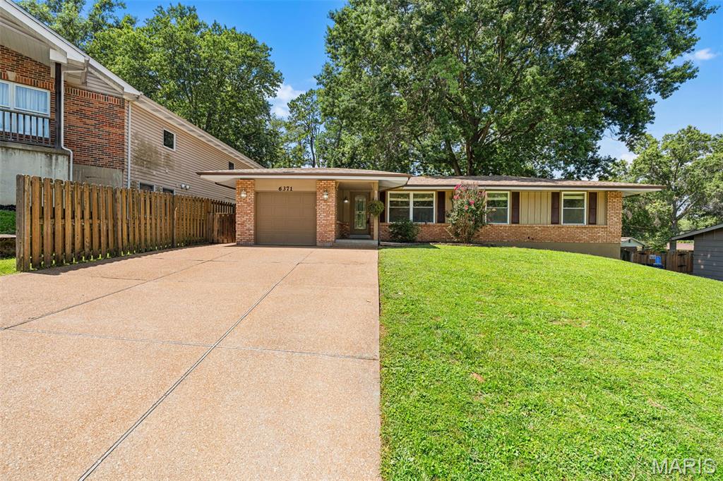 This Oakville ranch has all the green flags! From the brick exterior to the long list of updates, this 3-bedroom, 2-bath home is ready to impress. Offering over 1200 square feet, an attached one-car garage, and an oversized driveway with room for up to six vehicles, there’s plenty of space for everyday living and entertaining.
The updated kitchen is the true centerpiece, featuring custom 42-inch cabinetry, granite countertops, a center island, recessed lighting, stainless steel appliances, a new microwave, and a new garbage disposal. The spacious primary suite offers a beautifully updated walk-in shower with custom tile surround, while the additional bedrooms provide comfortable space for family, guests, or a home office. Custom blinds and a gorgeous custom front door add even more character throughout.
Need extra space? The unfinished walkout basement with a utility sink is ready for your storage, workshop, home gym, or future finishing ideas. Outside, you’ll enjoy a fully fenced backyard with a wooden privacy fence—perfect for pets, play, or relaxing evenings.
Big-ticket updates have already been taken care of, including a brand-new HVAC system backed by a 10-year warranty, so you can move in with confidence instead of adding projects to your weekend plans.
Located just minutes from Bee Tree Park, Oakville Sports Pub, and conveniently nestled between Point Elementary and Oakville Middle School, this home checks all the right boxes. Join me Saturday 8/8 from 11AM-1PM for the Open House!