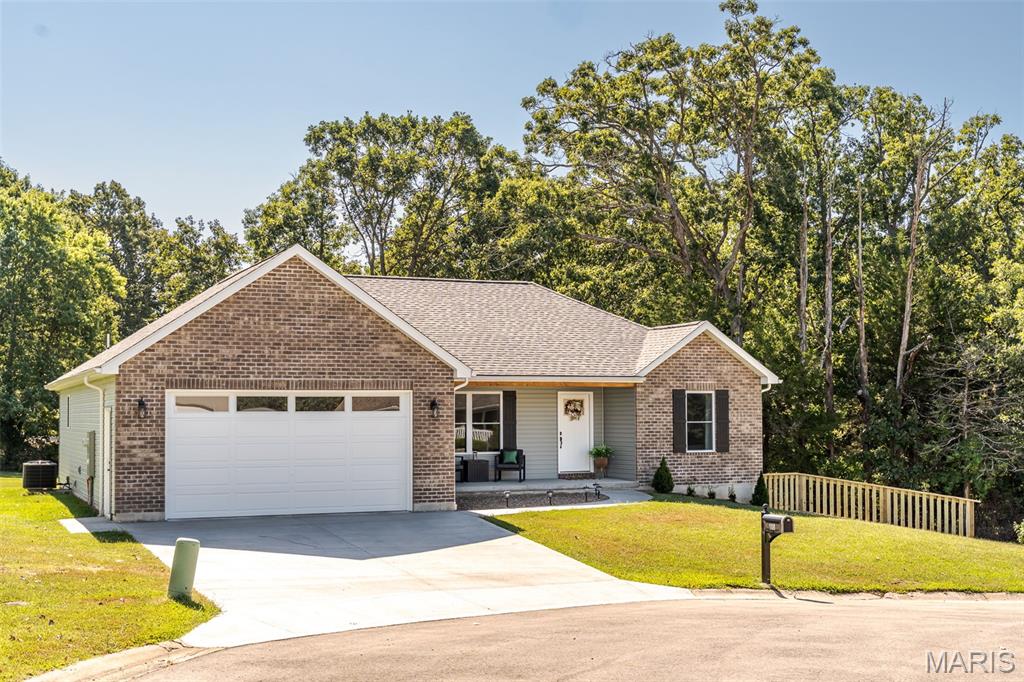 Better than NEW!!  Take a look at this gorgeous ranch style home that welcomes you in with a warm decor, high vaults, LVP flooring throughout and lots of windows for great natural light!  Step into the inviting living room offering a comfortable "homey" vibe where you will want to relax at the end of the day!  The kitchen offers a convenient workplan with multi-level cabinetry & lots of kitchen counterspace which the cook of the family will love, along with a breakfast bar, handy pantry plus all stainless appliances are included.  Enjoy meals in the bright dining area that exits onto a nice patio, perfect for barbecuing and overlooks the big backyard!  Retreat to the primary suite featuring a huge walk-in closet plus an ensuite bath with dual vanities & step-in shower while 2 other bedrooms, in a split-plan, give everyone a place of their own!  Great closet space, too!  Downstairs, a wonderful bedroom plus full bath are ready to go.  Also, make use of the "storm/safe room" with insulation for low humidity, shelving AND steel door...ready for storm or gun storage safety!!  Lots of options for the rest of this walk-out basement which would be perfect for finishing a family room, a place to exercise, handy workshop area or great storage!  Completing this well maintained home is a main floor laundry w/deep sink (washer & dryer are included, too) plus oversized garage with man-door!  Situated in a cul-de-sac, with a gravel drive alongside for extra parking, there's LOTS of room for kids and pets to run on this 0.37 acre lot...even room for a garden!  Located in a wonderful community, this would be a great place to call HOME!  Move-in ready for YOU!  
**Gorgeous hutch in living room can remain with home!  Metal storage shelving in basement does not remain.**