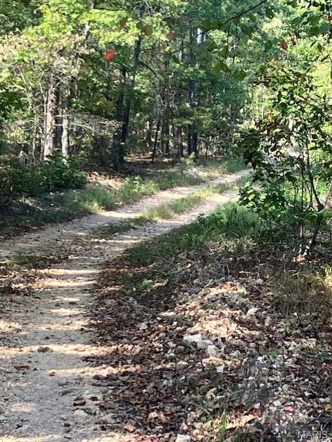Looking for a wooded getaway property. This could be it. This 21.45 acres is wooded but has a deeded access road along two sides. 
It also includes deeded access to a nearby shared spring-fed stream, and sits within about a mile of Mark Twain National Forest. 
This affordable Ozark oasis comes with NO restrictions, and can be had for less than the price of a new truck. And there's a nice deeded easement gravel road leading from the county road to your property.
Hunt, camp, build, ride ATVs on your own land, or fish or play in the shared creek section ... endless opportunities.
This property is wooded and rolling. You are within a mile of the 22,176-acre Mark Twain National Forest ... public ground where you can also hunt, ride and explore. All this, and only about 2 miles by road from U.S. 67.
Use this land as a base camp for adventure. This and surrounding land is teeming with deer, turkey and small game, and the occasional feral hog or maybe a black bear.