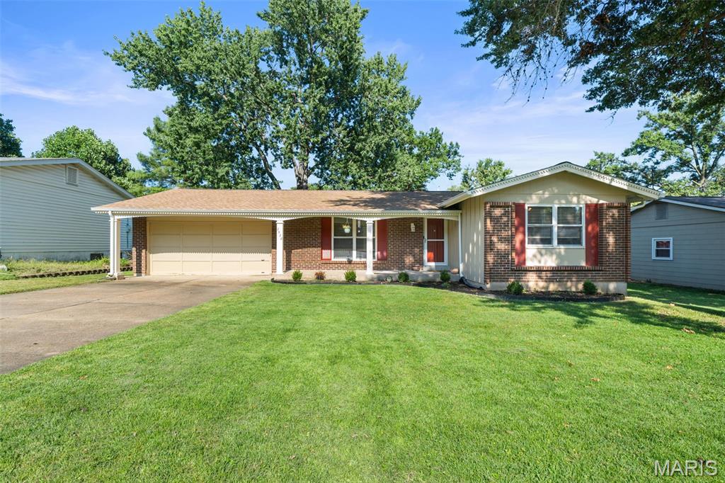 Located in the established Wesglen Estates neighborhood of Maryland Heights, this well-maintained 3-bedroom, 2.5-bath home with over 1,900 square feet of living space offers thoughtful updates, flexible living space, and a private backyard with easy access to the nearby greenway. Inside, hardwood floors and abundant natural light create a warm, inviting feel. The updated kitchen features newer cabinetry, granite countertops, tiled backsplash, stainless GE appliances, and a breakfast bar peninsula that opens to the dining area. Sliding glass doors fill the space with natural light while providing a wonderful view of the fenced backyard and direct access to the concrete patio—perfect for outdoor dining and entertaining. Three bedrooms are located on the main level, including a primary bedroom with a private renovated bath featuring tiled shower walls. Downstairs, the finished lower level adds substantial versatility with new carpeting, a spacious family room, flex space with wet bar, half bath, and two additional finished rooms ideal for home offices, hobbies, storage, or potential sleeping areas. Outside, enjoy a private fenced backyard, concrete patio, attached two-car garage, and nearby walking access to the greenway. Additional improvements include a newer roof (2023), newer gas water heater, and whole-home water softener and filtration system. With updated finishes, multiple living spaces, and a convenient Maryland Heights location, this Wesglen Estates home offers plenty of room to settle in and enjoy.