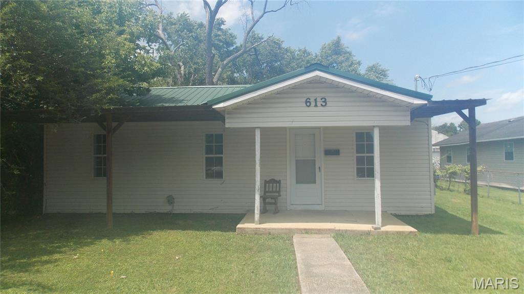 Move-in ready, 2-bedroom, w/office, 1 bath home in an area of remodeled homes, Covered front and back porches.