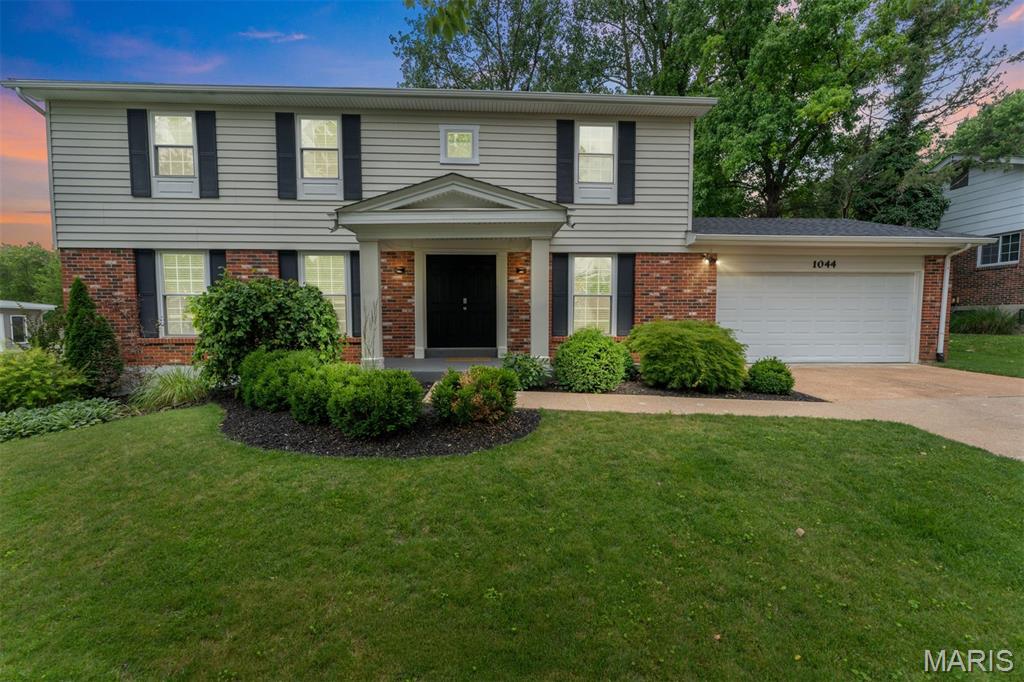 Welcome home to Fox Creek Estates! Discover the perfect blend of comfort, convenience, and community in this beautifully updated 2-story home nestled on a in the heart of Ballwin. Offering over 2,500 square feet of living space, this exceptional property is located in the highly acclaimed Parkway West School District and is within walking distance to Queeny Park. This move-in-ready home offers the perfect combination of style, space, and functionality. The inviting living room features a stunning custom bookcase, creating the perfect focal point. The completely updated kitchen is a chef's dream, showcasing new cabinetry, granite countertops, and a large center island that provides ample prep space and seating. The family room offers a cozy gas fireplace, creating a warm and welcoming atmosphere. Step outside to an amazing backyard retreat featuring a covered patio—ideal for outdoor dining, entertaining, or simply enjoying the peaceful surroundings. Upstairs, you'll find four spacious bedrooms with the potential for a fifth bedroom, home office, or flex space. The updated primary suite boasts a beautifully renovated bathroom complete with a stunning walk-in shower. The finished lower level expands your living space with a large recreation room, dedicated crafting area, and workout room, providing endless possibilities to fit your lifestyle. Residents will also enjoy access to the wonderful subdivision pool, perfect for cooling off during the summer months and enjoying a true sense of community. With thoughtful updates throughout and plenty of room to grow, this home is ready for its next owners to enjoy!